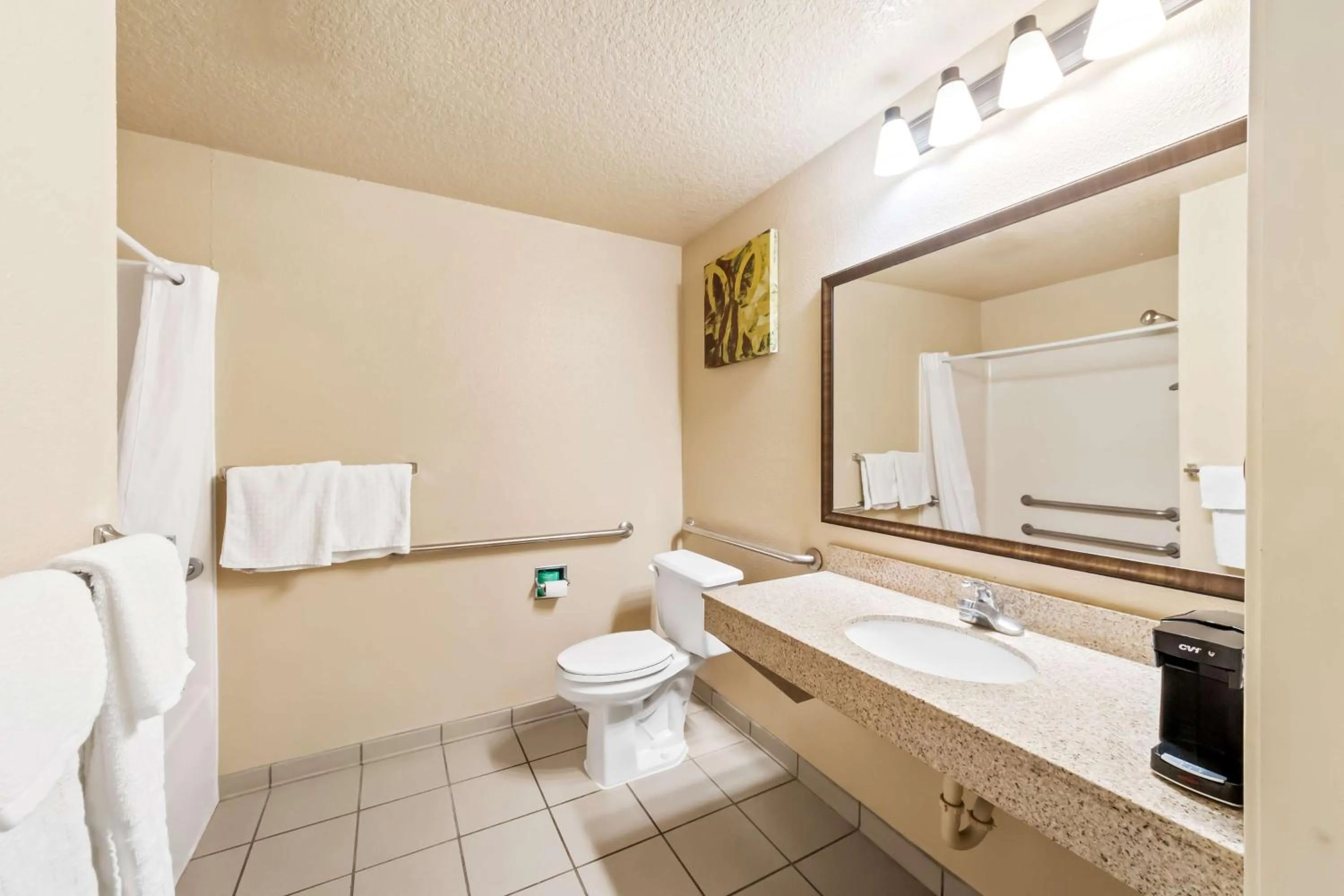 Bathroom in SureStay Plus by Best Western San Antonio Fiesta Inn