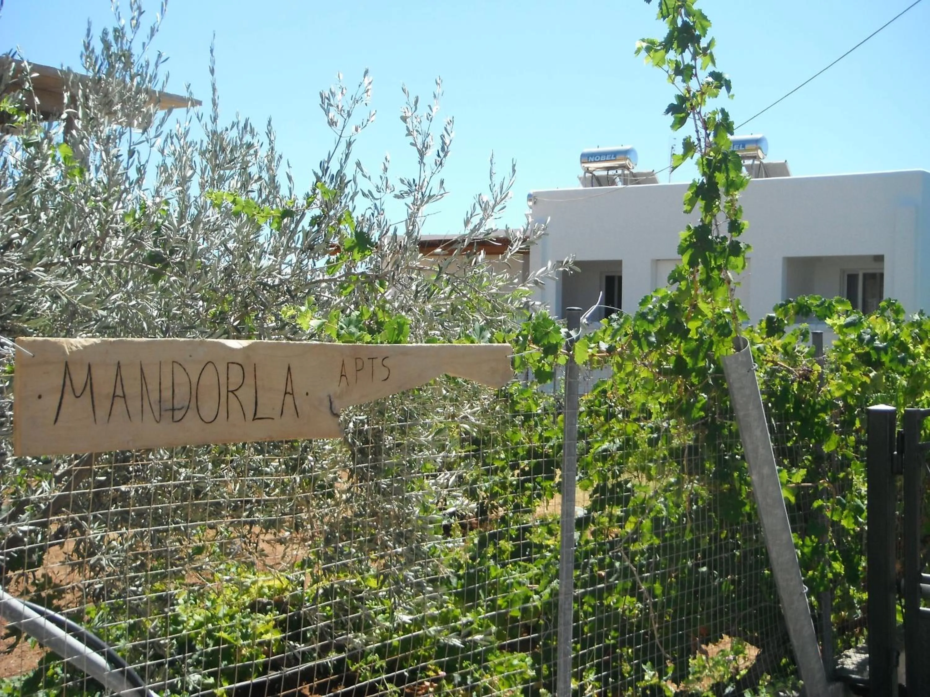 Property logo or sign in Mandorla Apartments