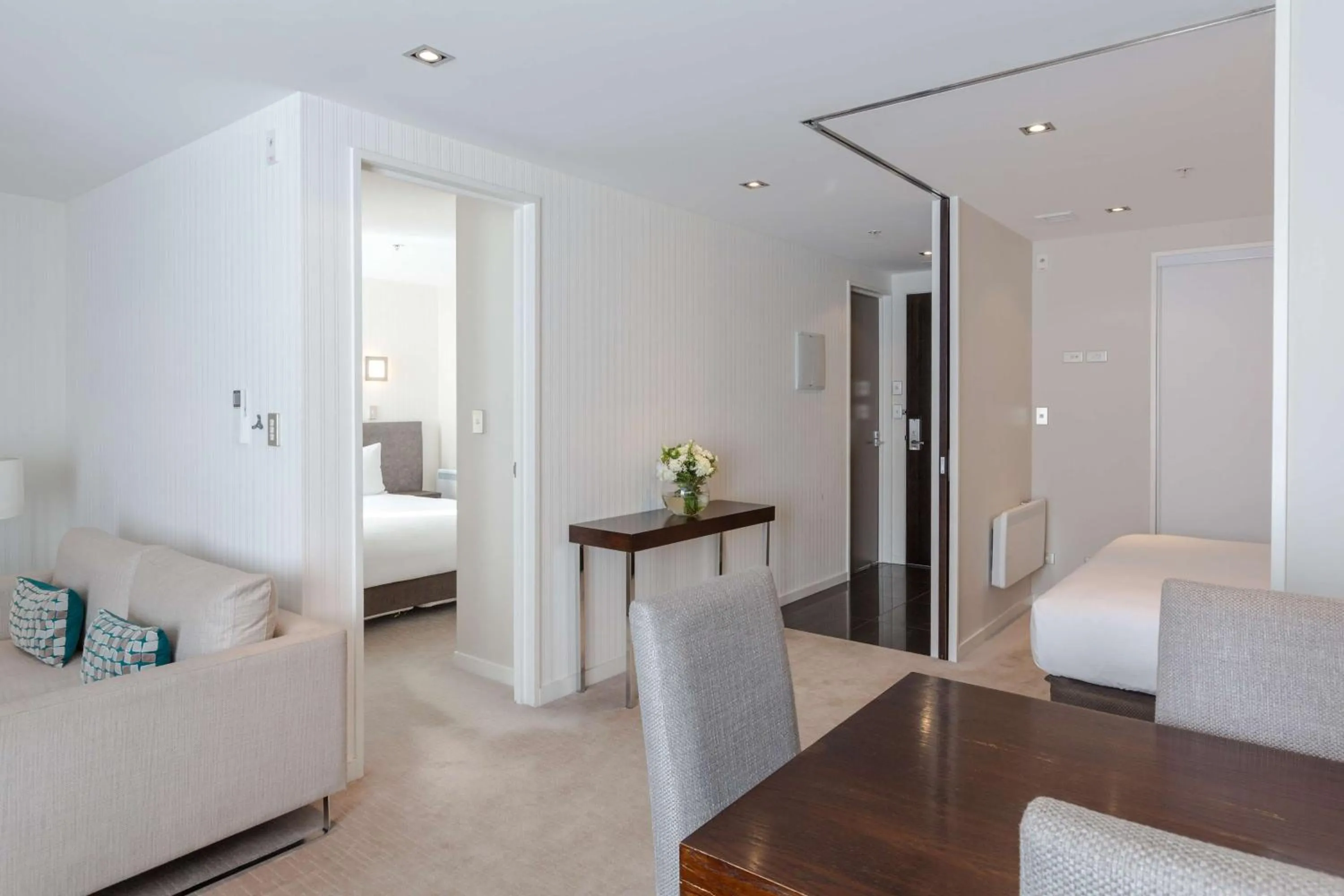 Living room, Bed in Hilton Queenstown Resort & Spa