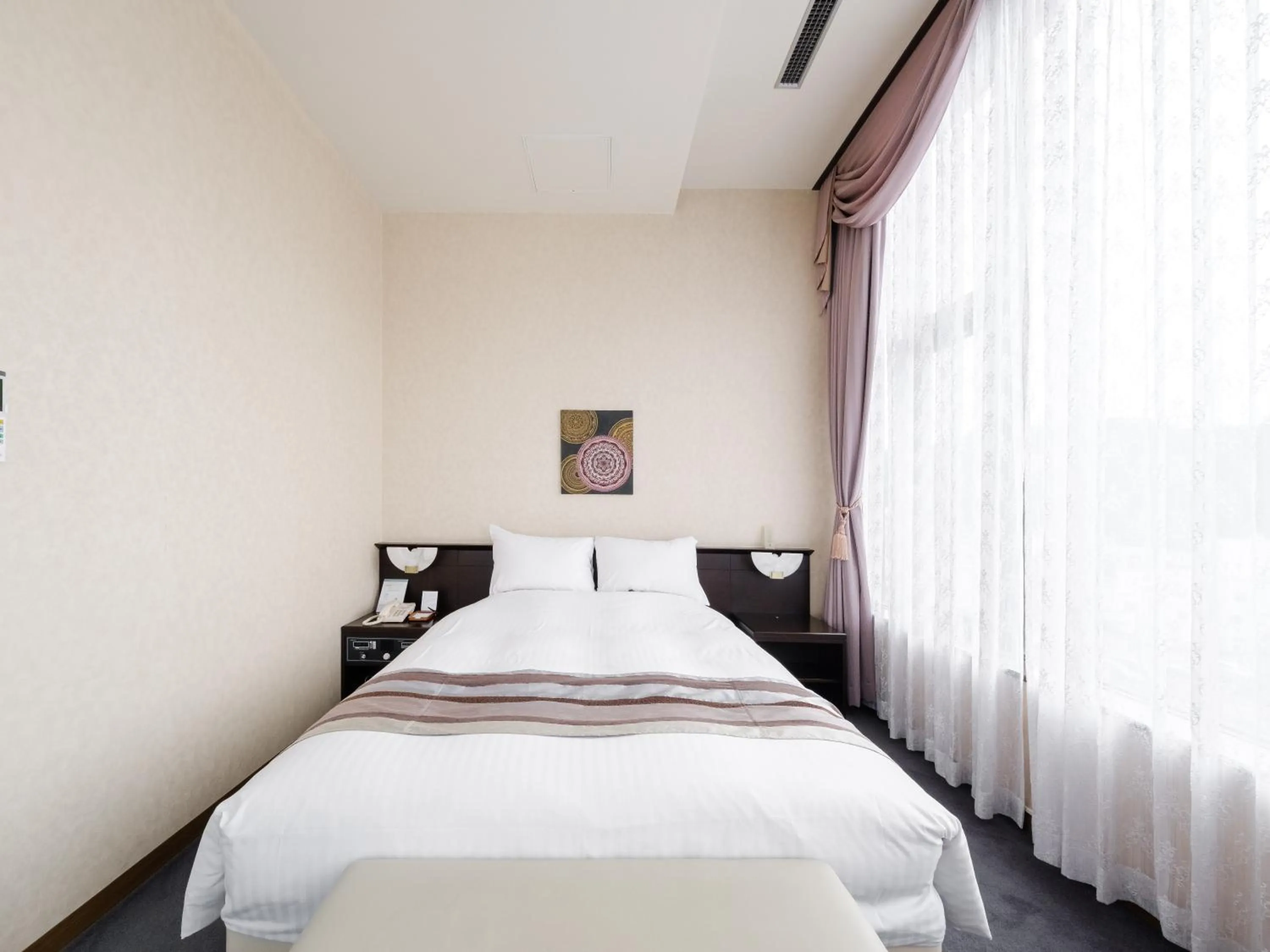 Bed in Tabist Abashiri Central Hotel