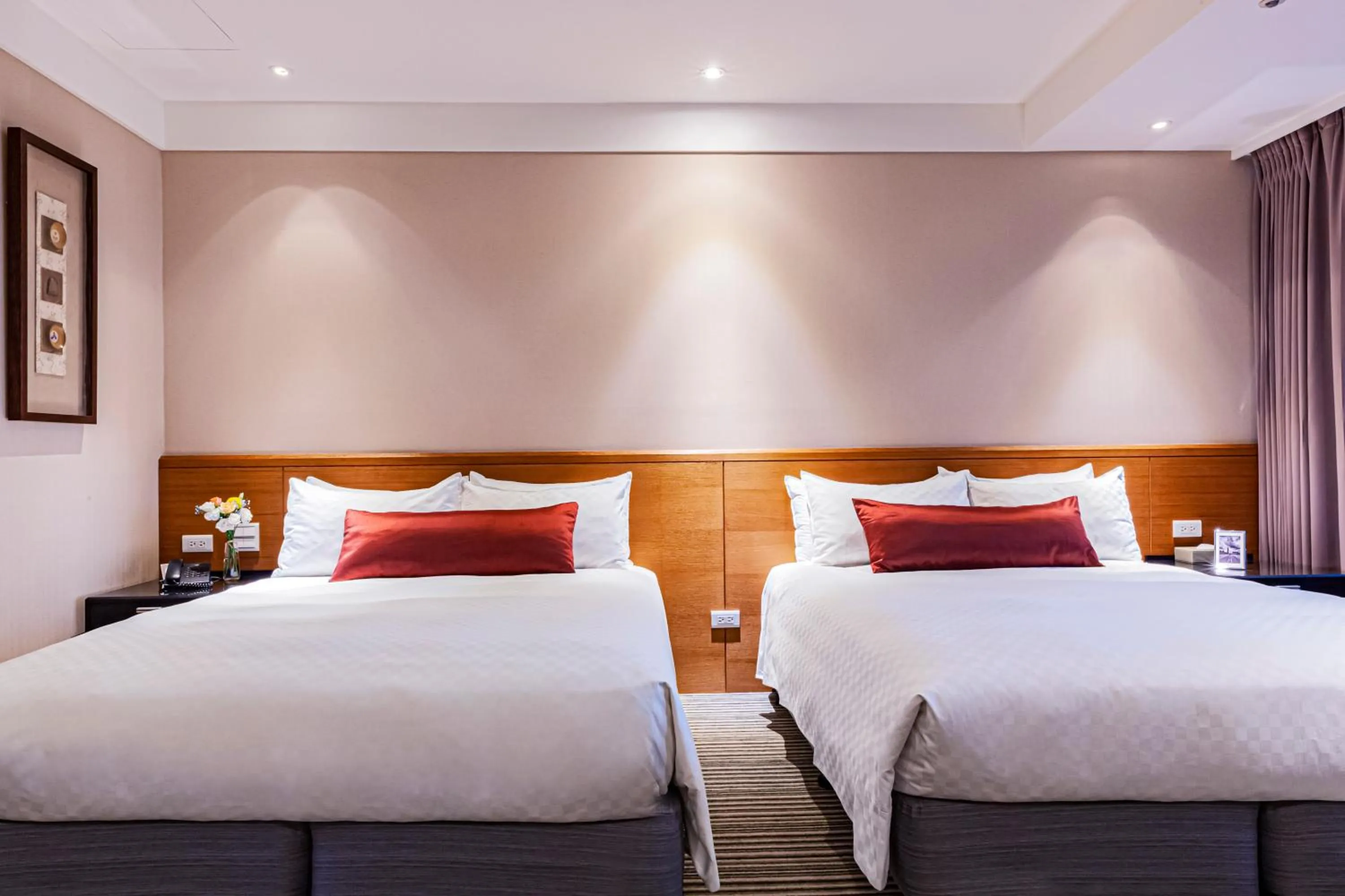 Bed in Pacific Business Hotel