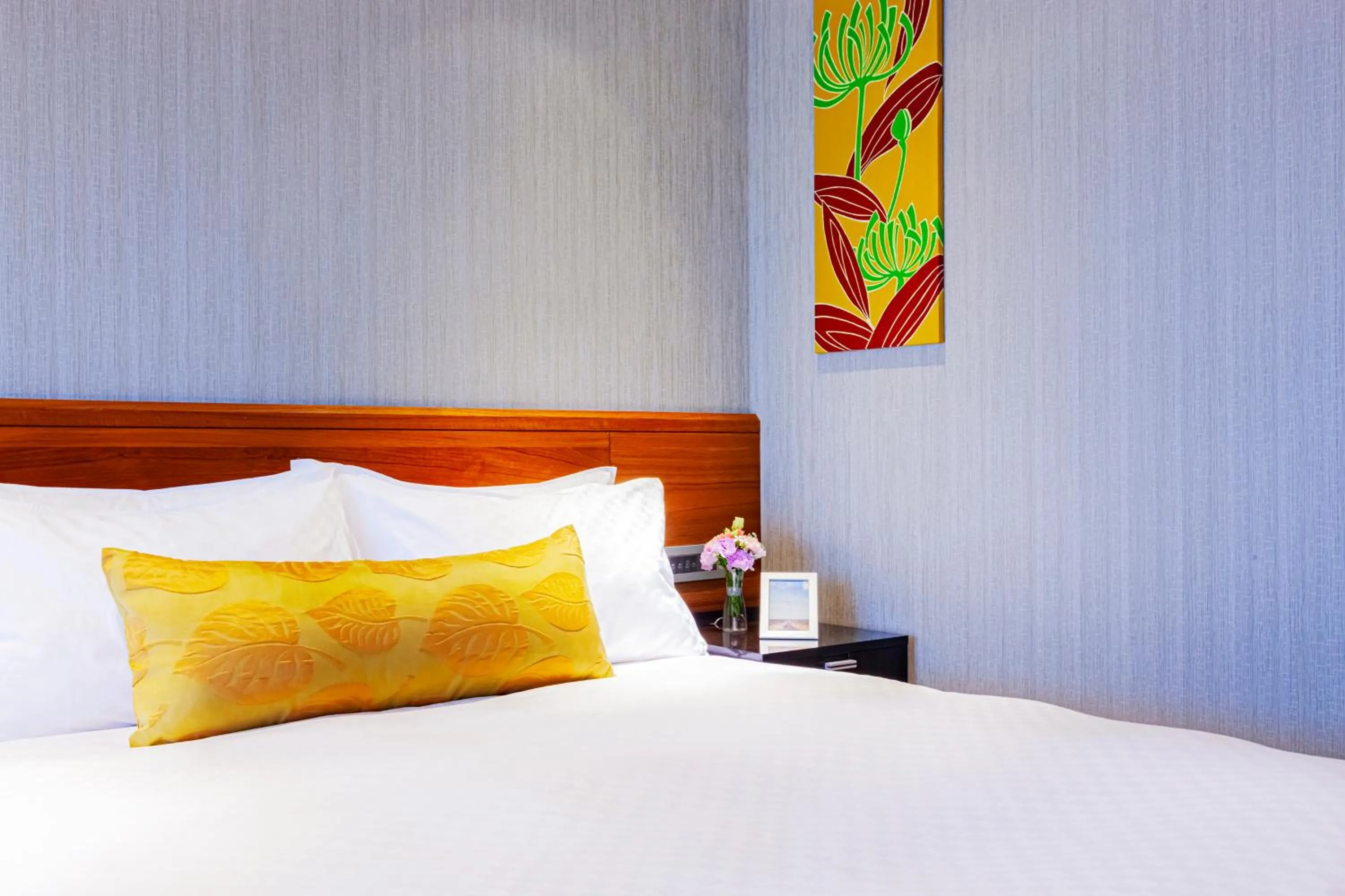 Bed in Pacific Business Hotel