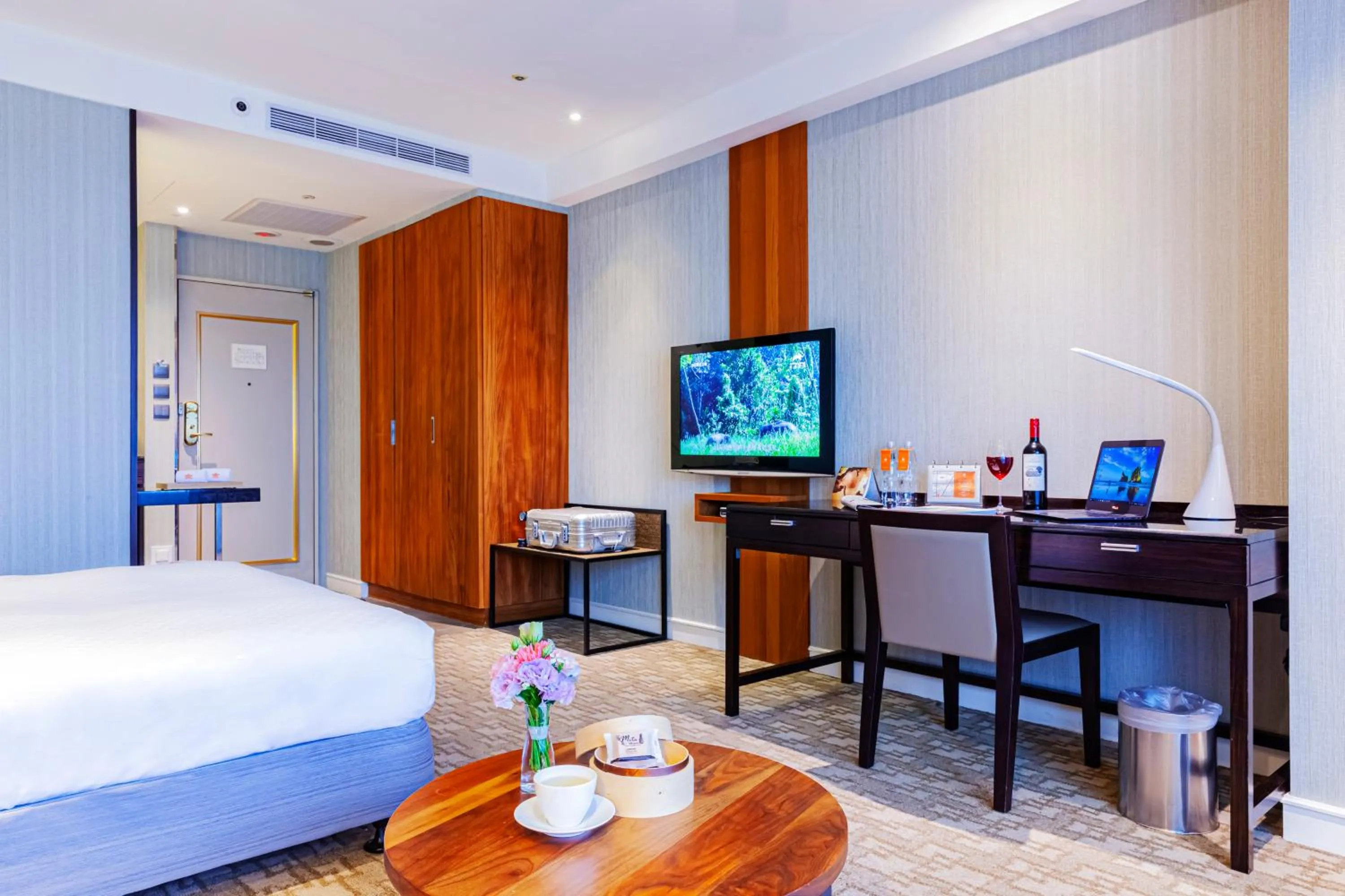 Bed in Pacific Business Hotel