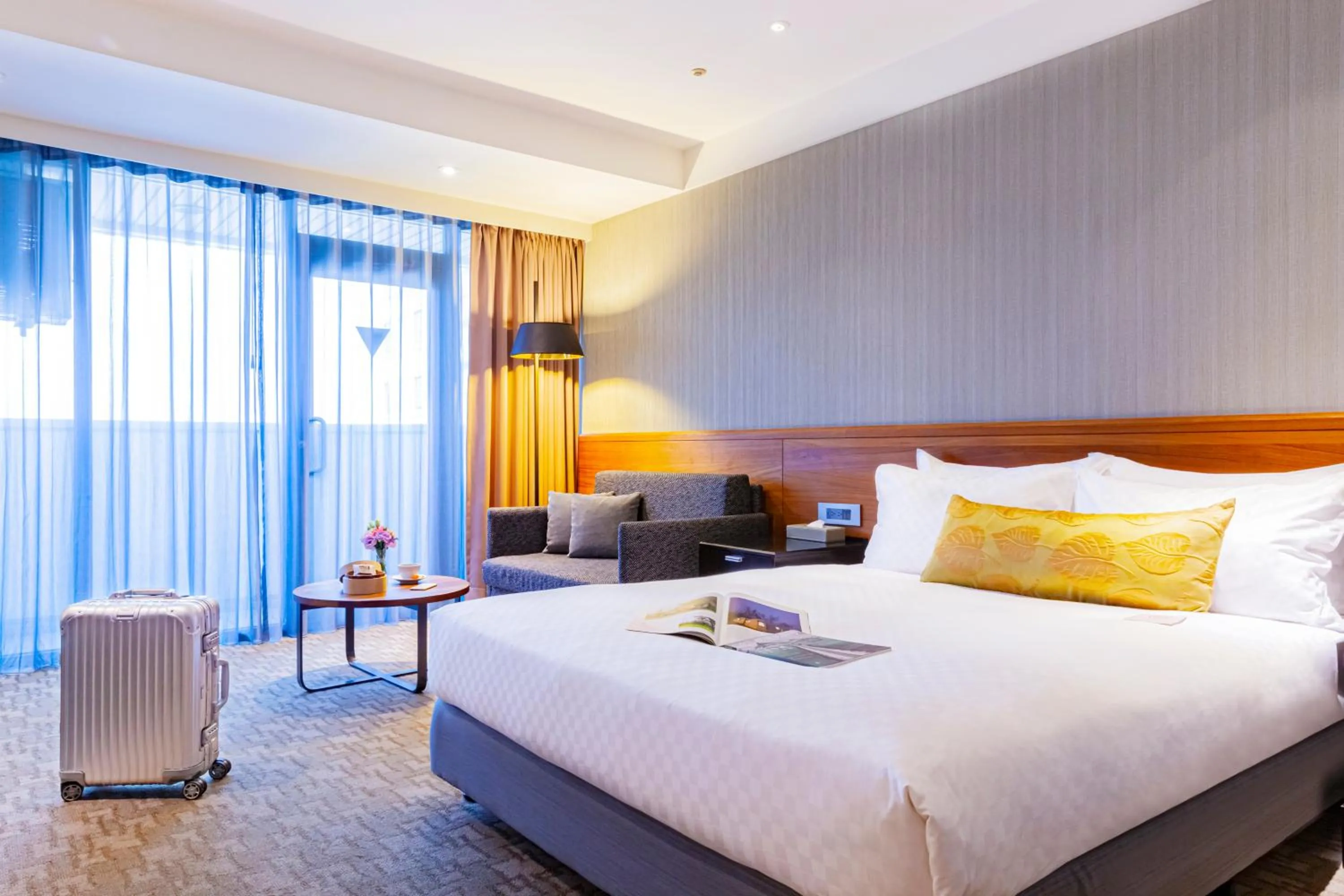 Bed in Pacific Business Hotel