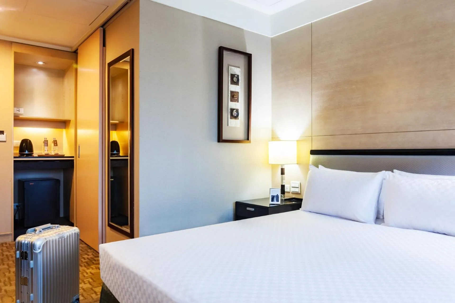 Bed in Pacific Business Hotel