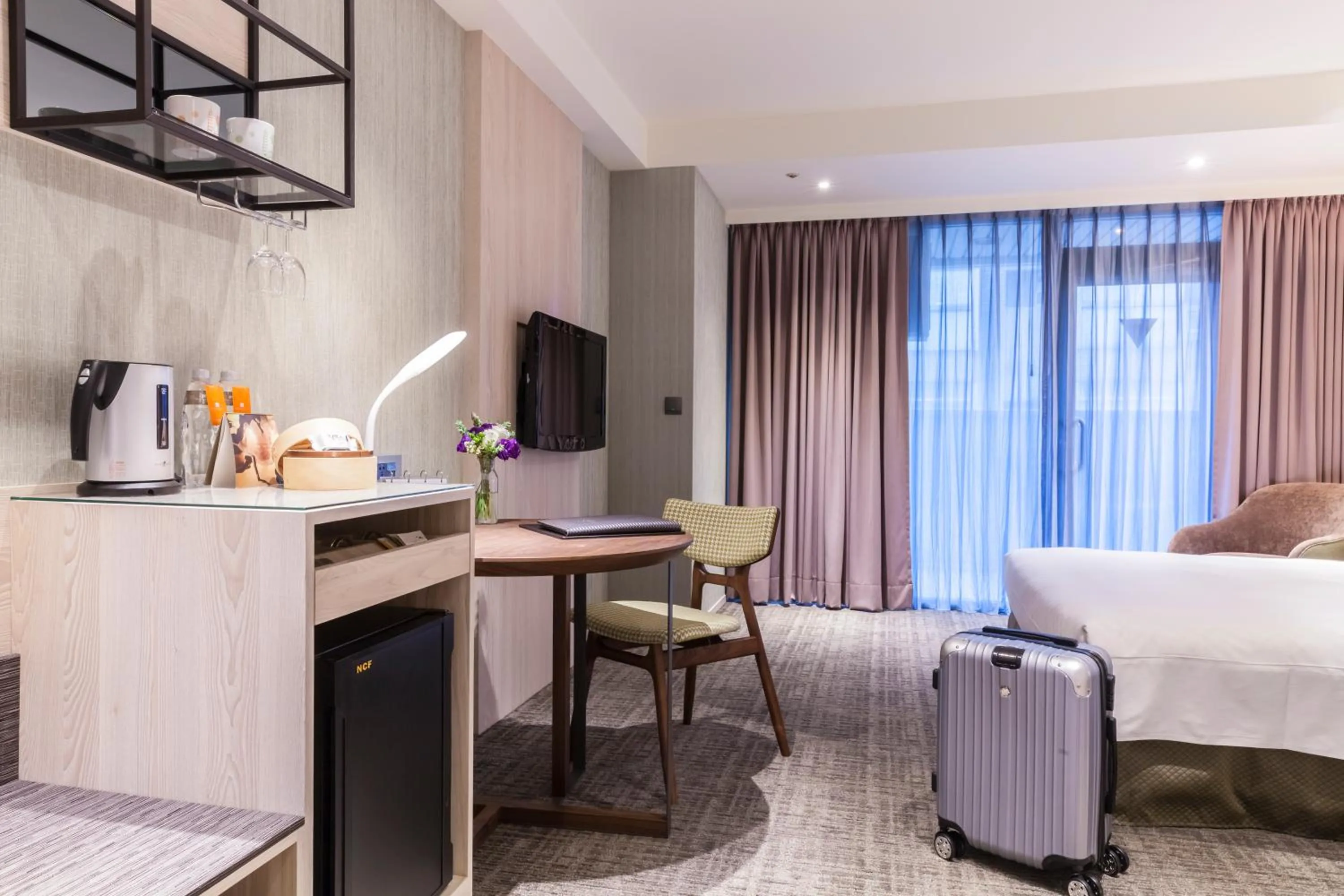 Bed in Pacific Business Hotel