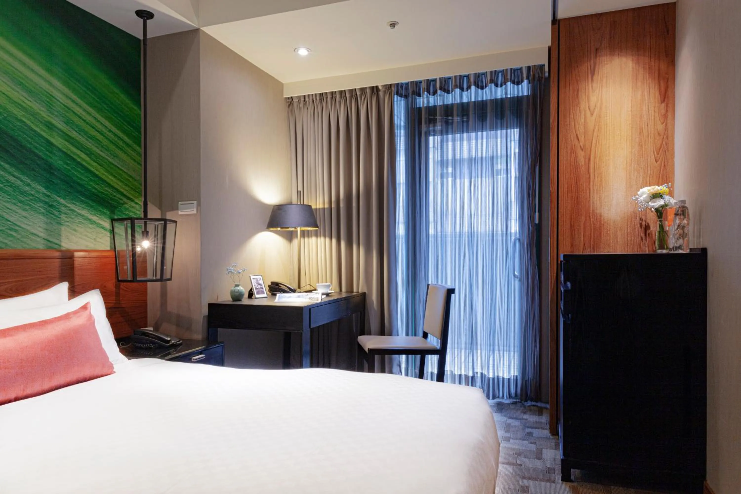 Bed in Pacific Business Hotel