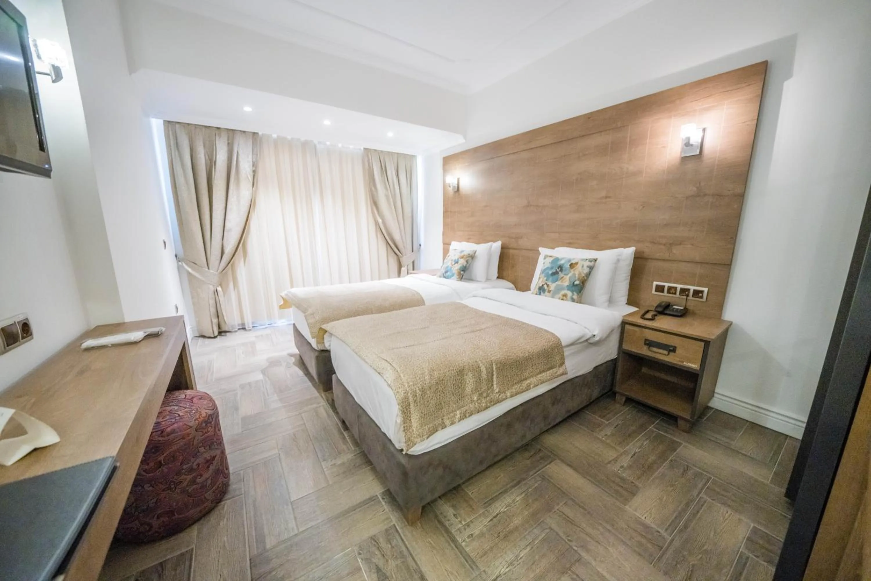 Bed in Aurasia Beach Hotel