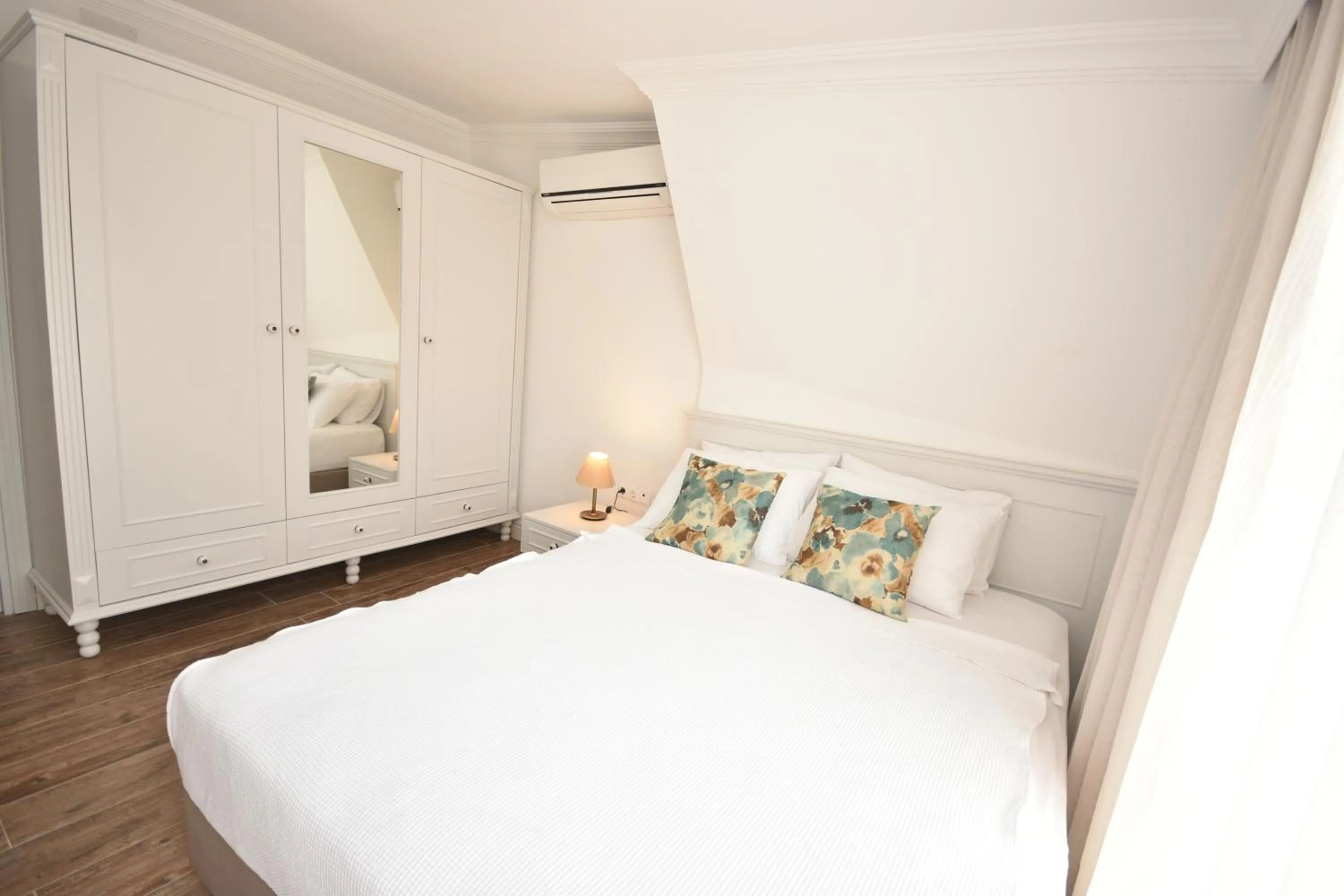 Bed in Aurasia Beach Hotel