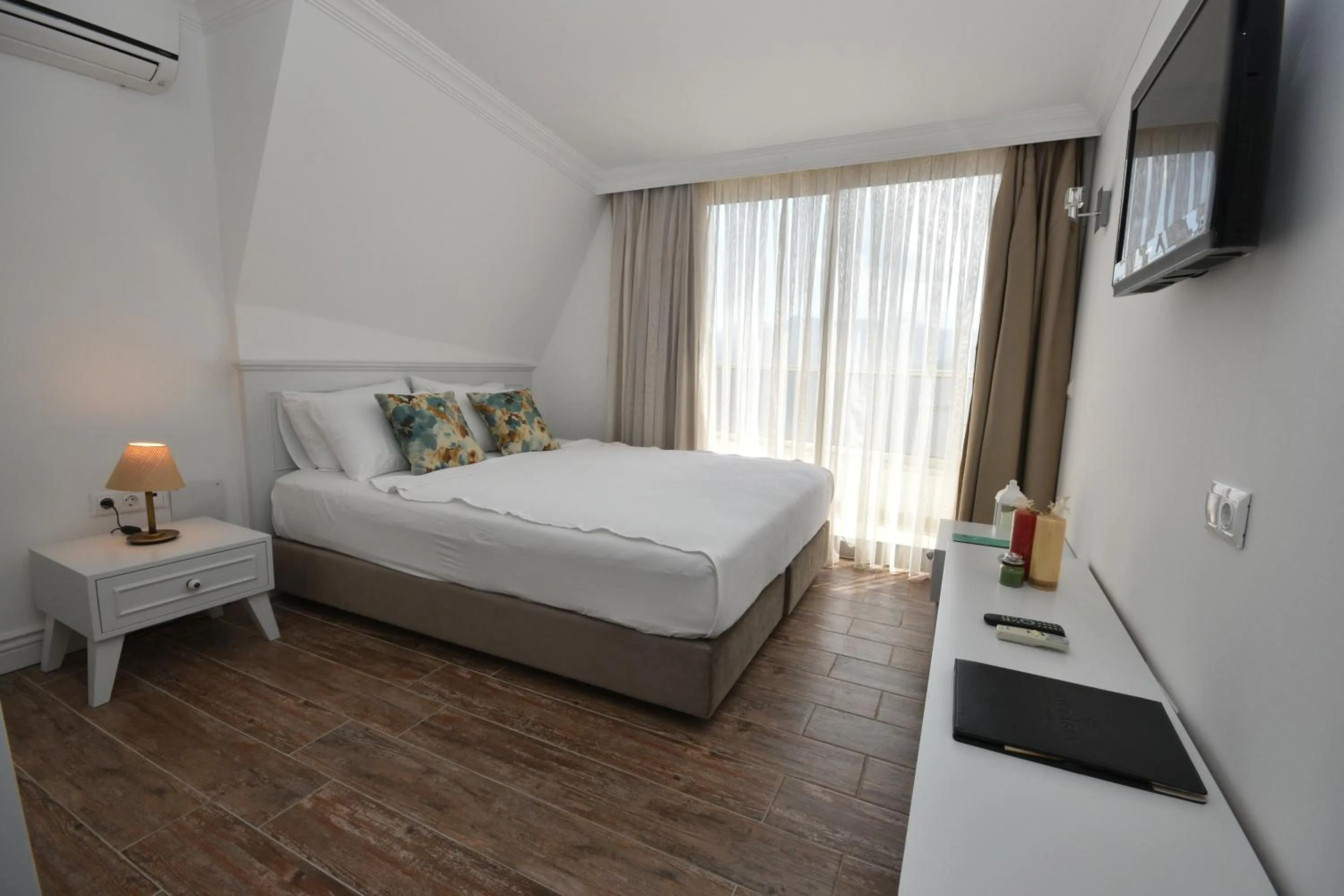 Bed in Aurasia Beach Hotel