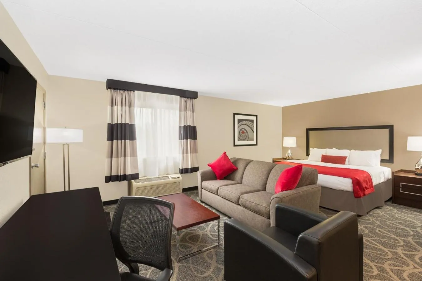 Bed in Ramada by Wyndham Des Moines Airport