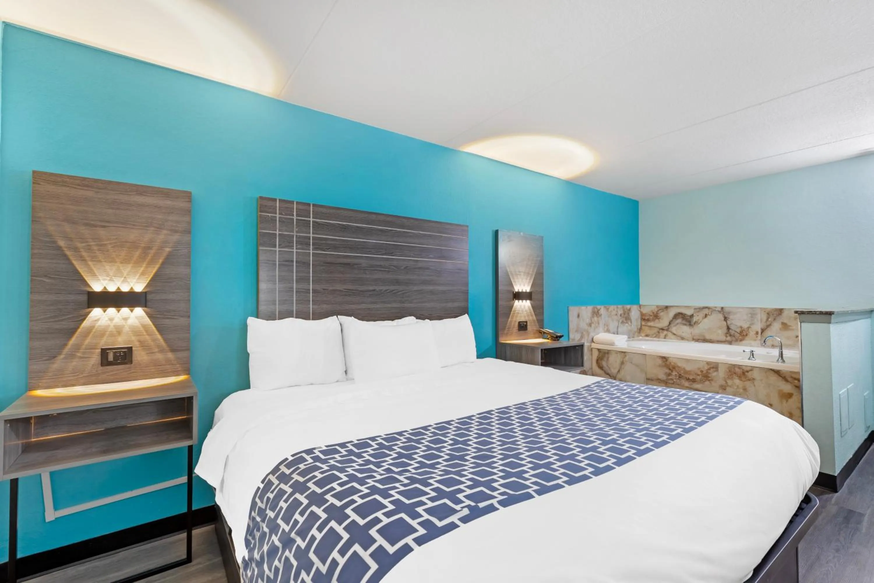 Bed in Ramada by Wyndham Des Moines Airport