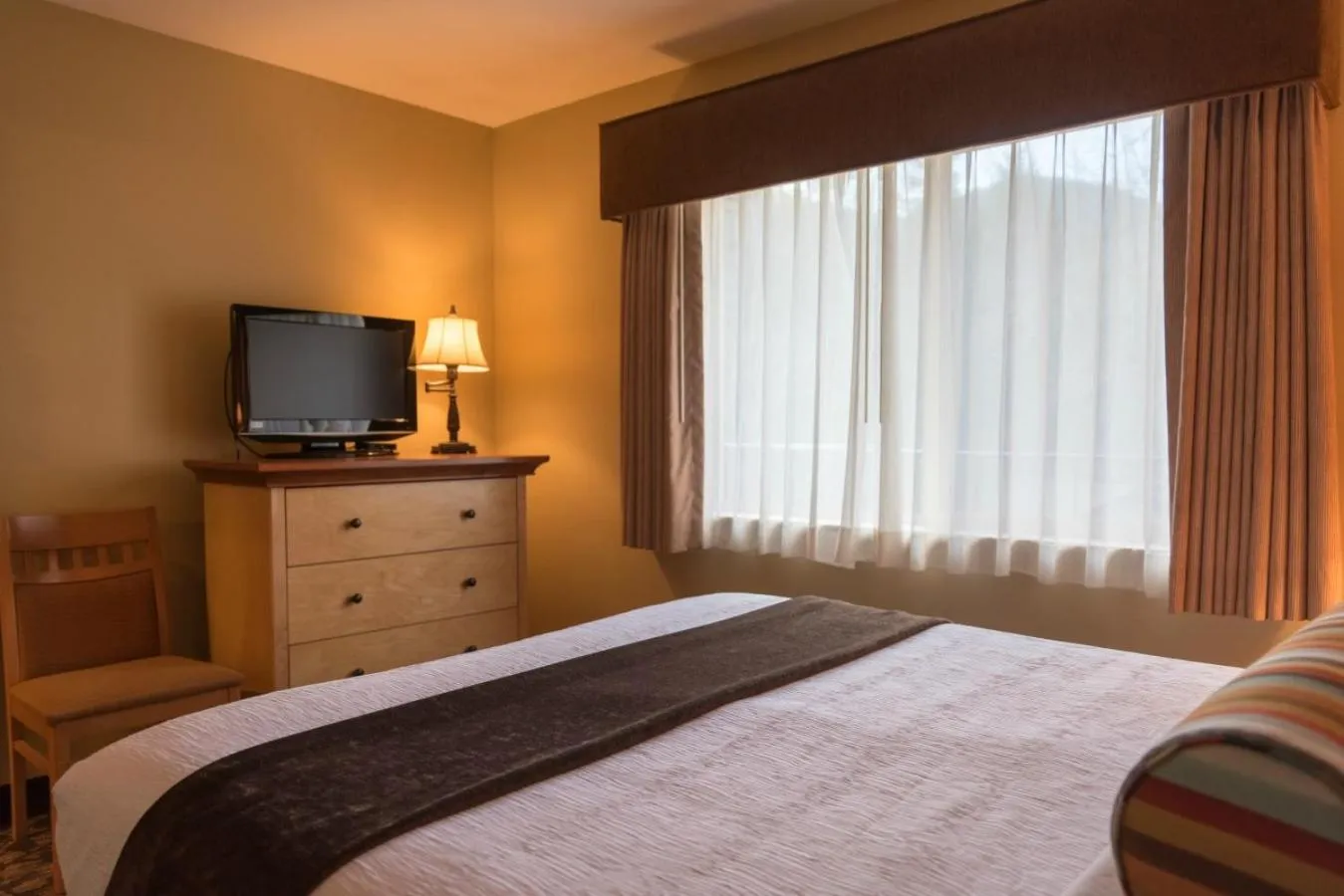 Bed in Whispering Woods Resort