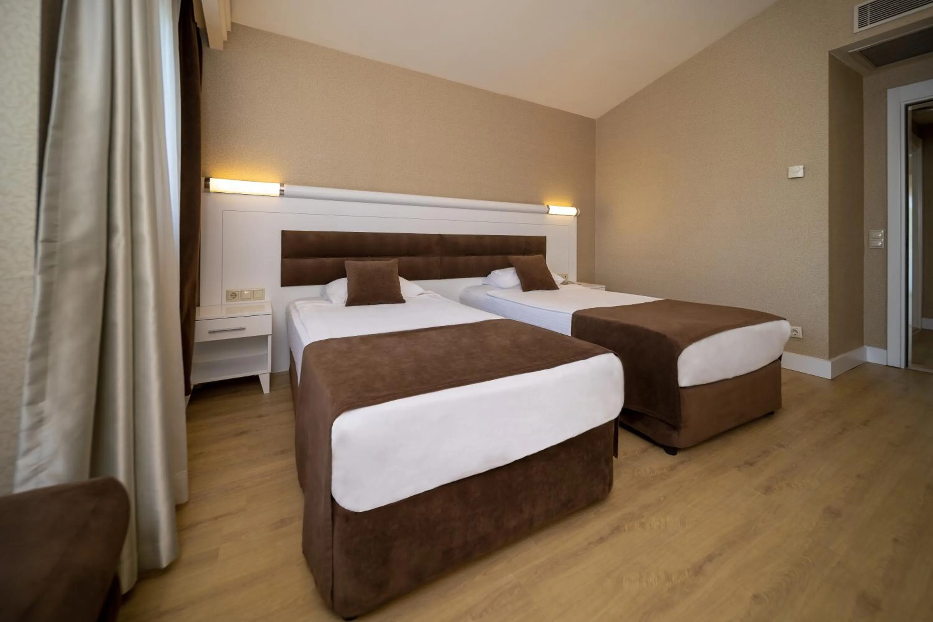 Bed in Sueno Hotels Beach Side