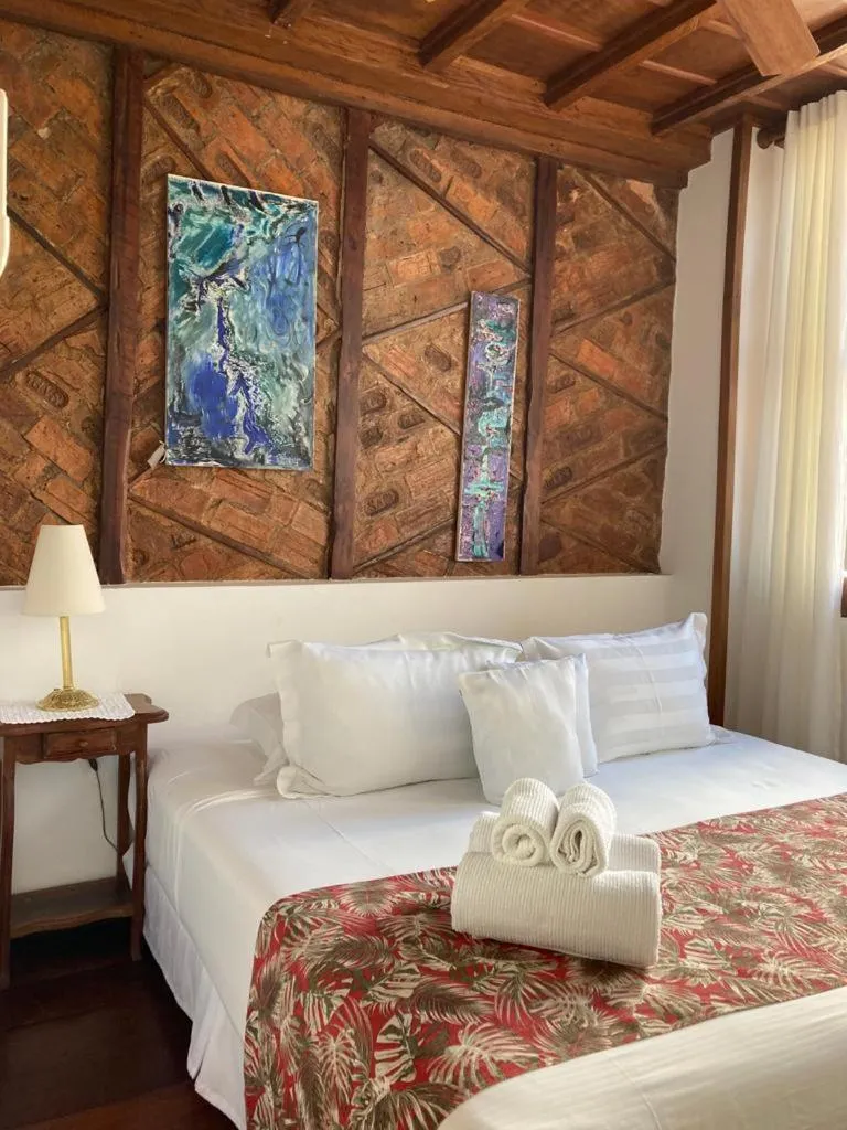 Photo of the whole room, Bed in Pousada Arte Urquijo