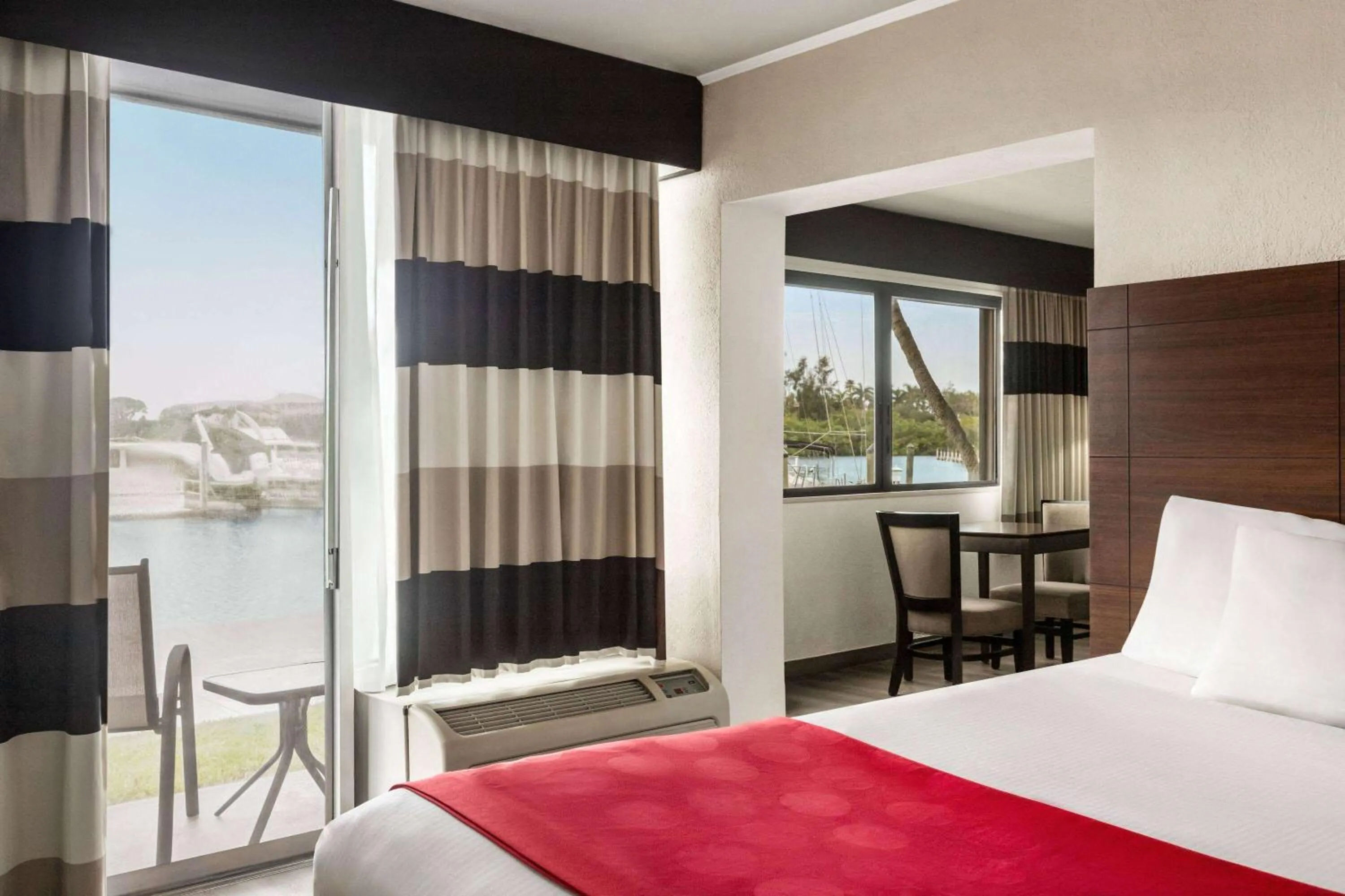 Photo of the whole room, Bed in Ramada by Wyndham Sarasota Waterfront