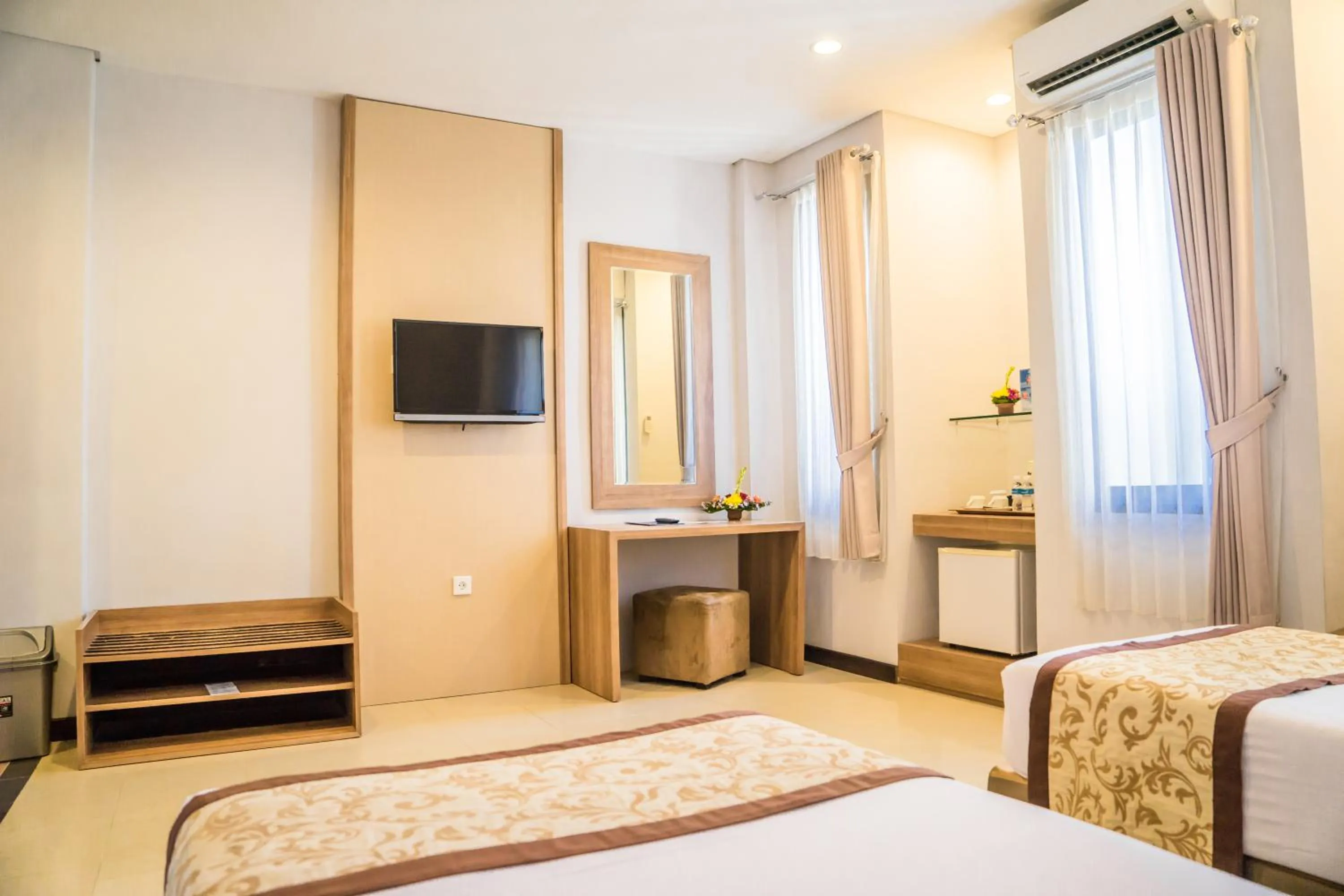 Bed in Hotel Puri Ayu