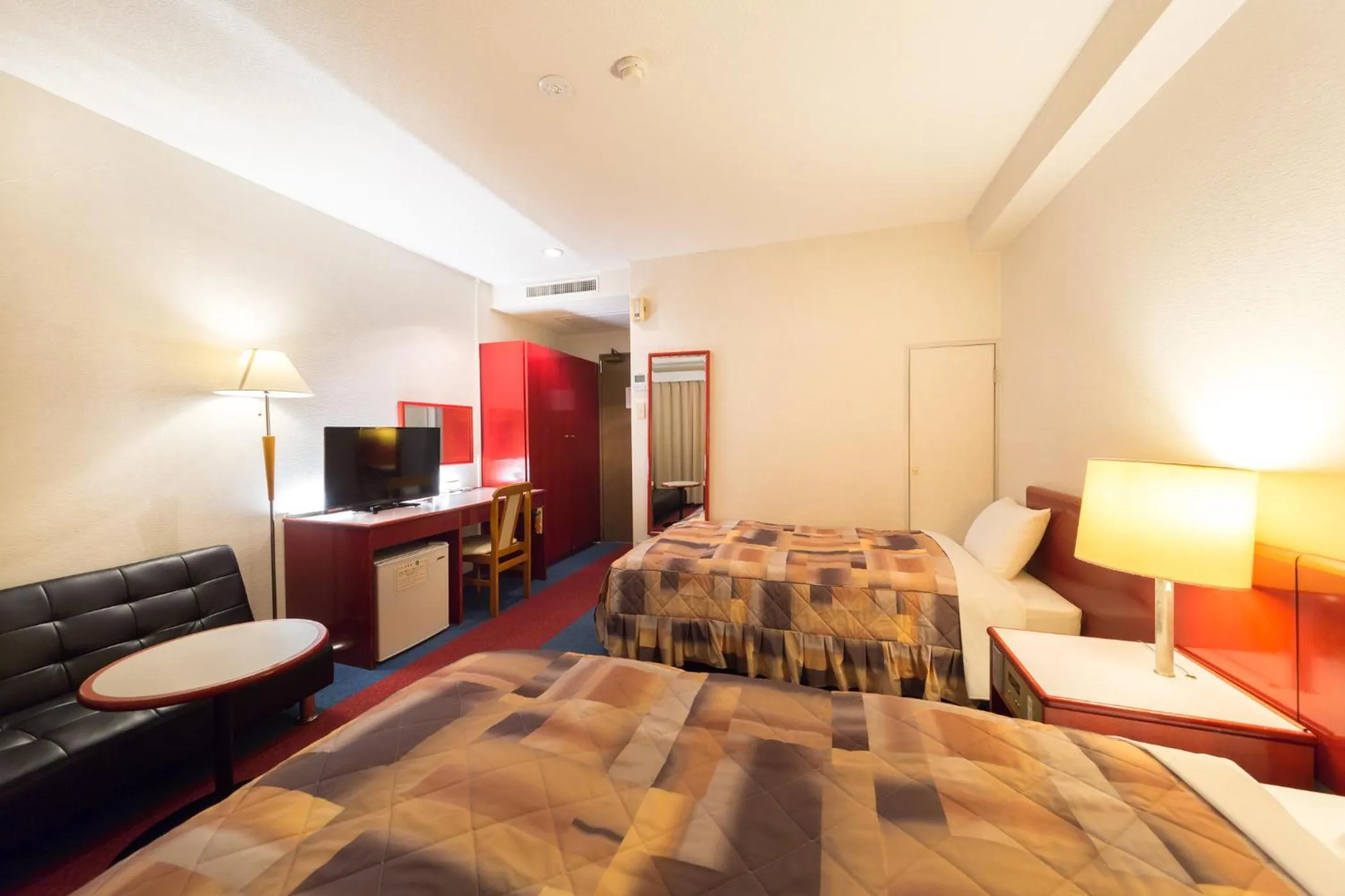 Photo of the whole room in Hotel Sunrise Inn