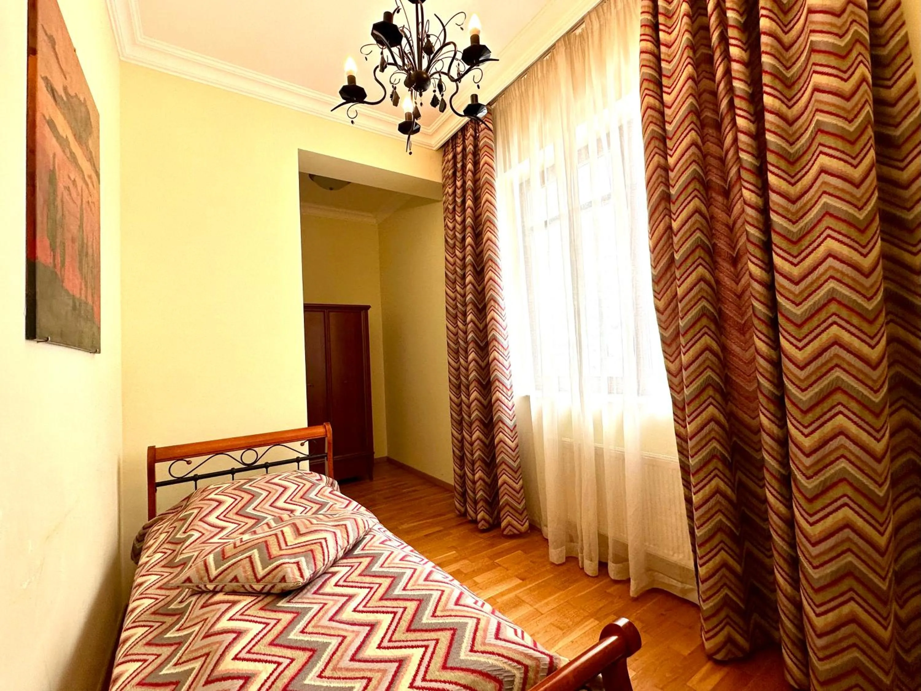 Bed in Slunecni Lazne Apartments