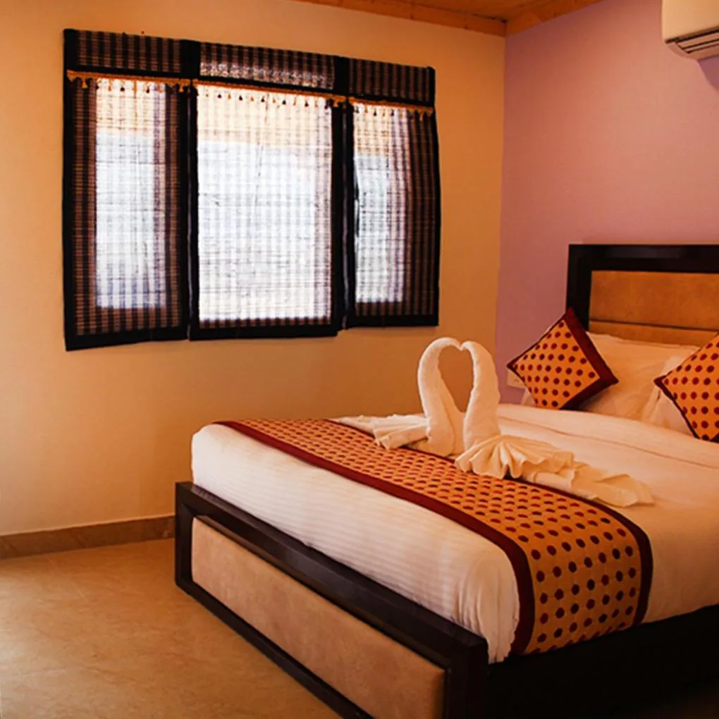 Bed in Four Banyans Spirit & Nature Resort