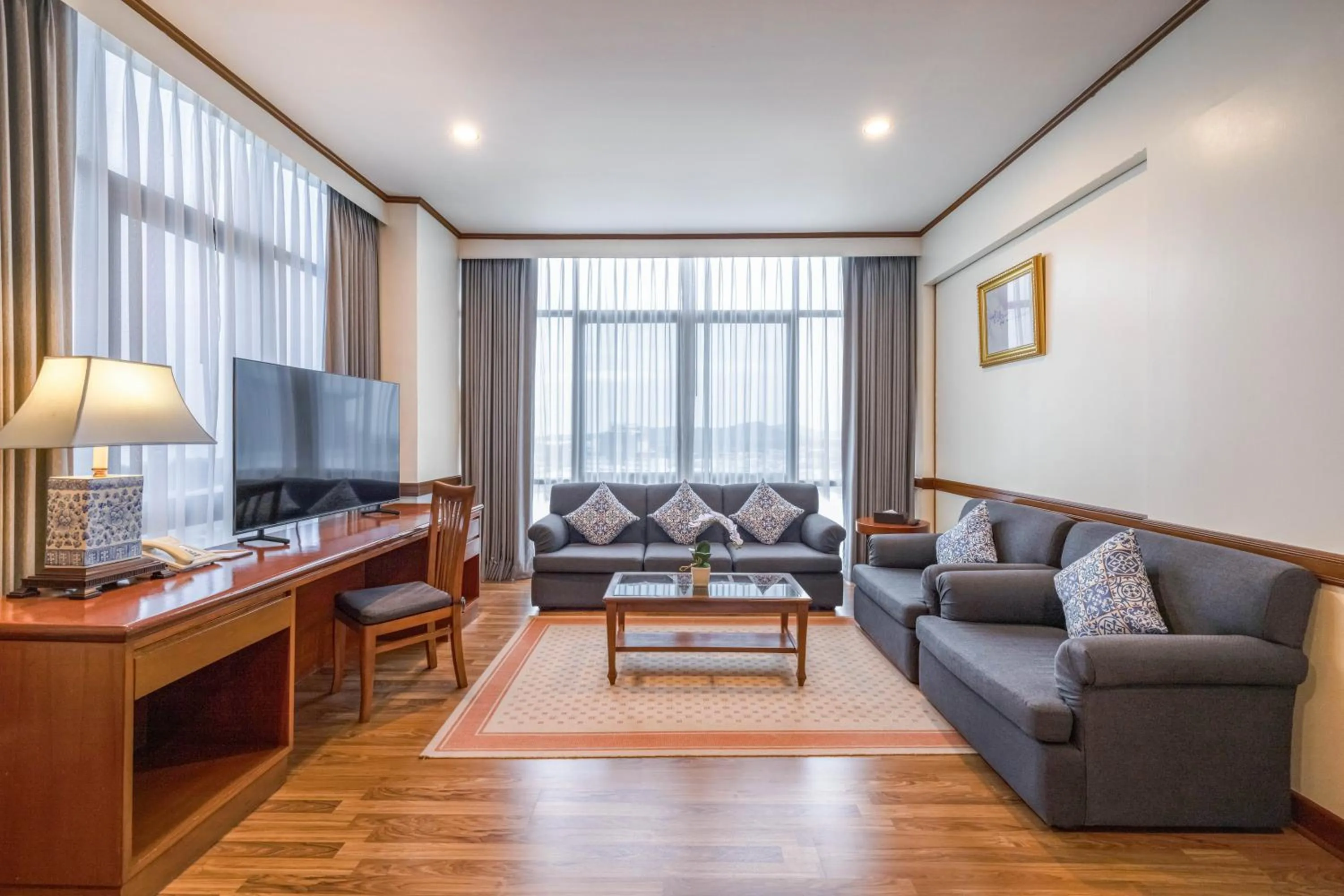 Communal lounge/ TV room in Royal Phuket City Hotel