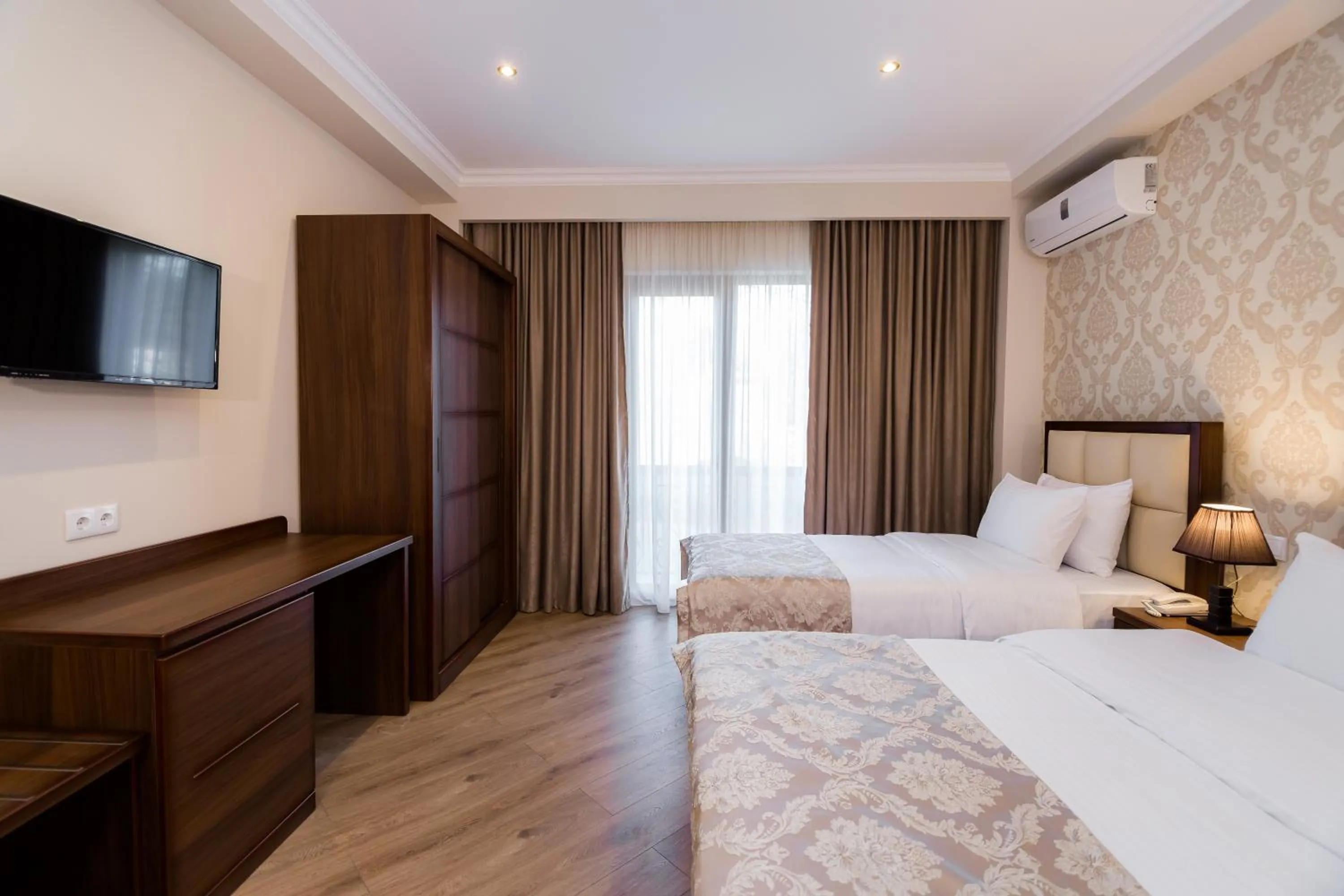 Bed in Orchid Boutique Hotel