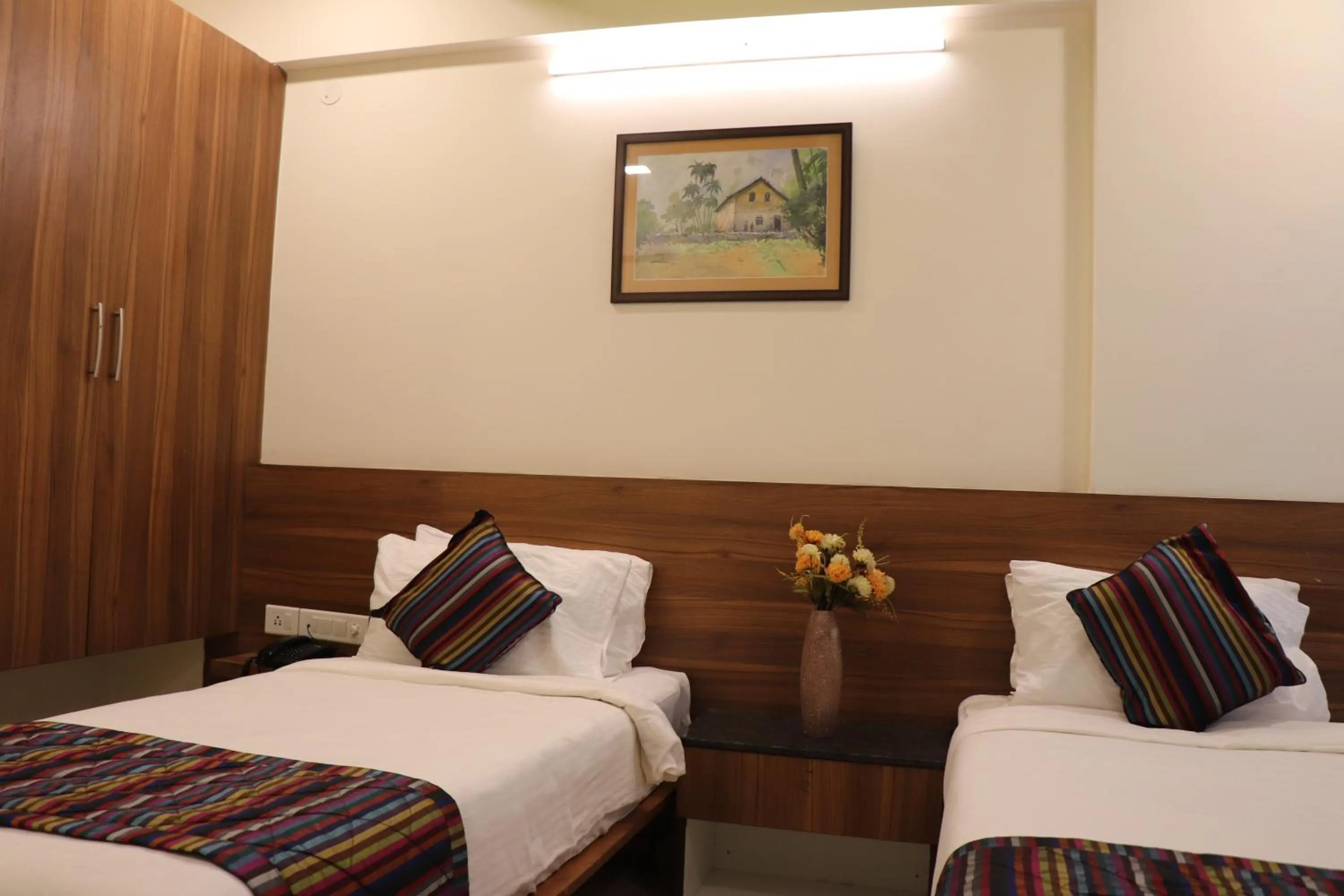 Bed in Silicon Inn Hotel Bangalore Airport
