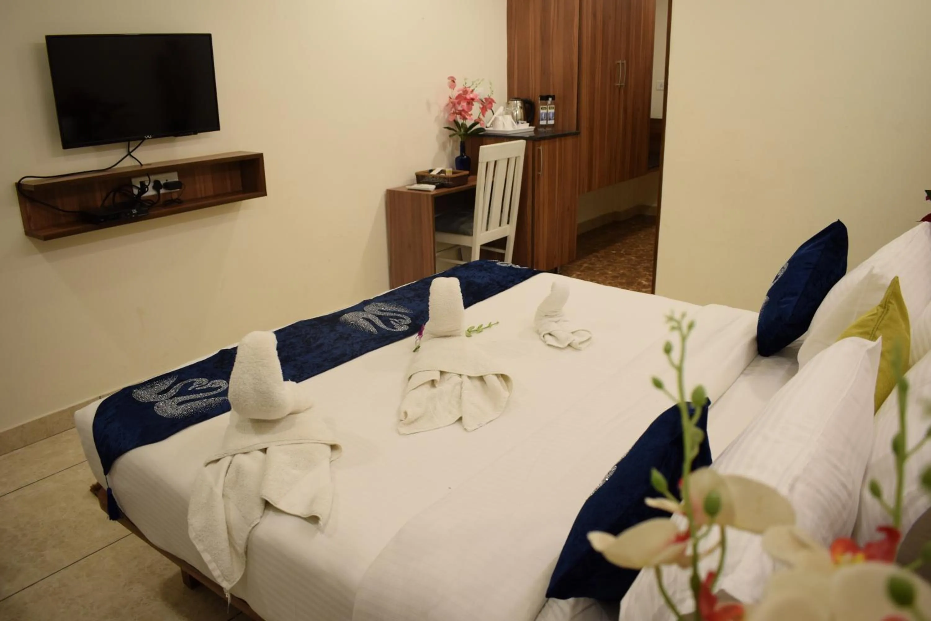 Bed in Silicon Inn Hotel Bangalore Airport