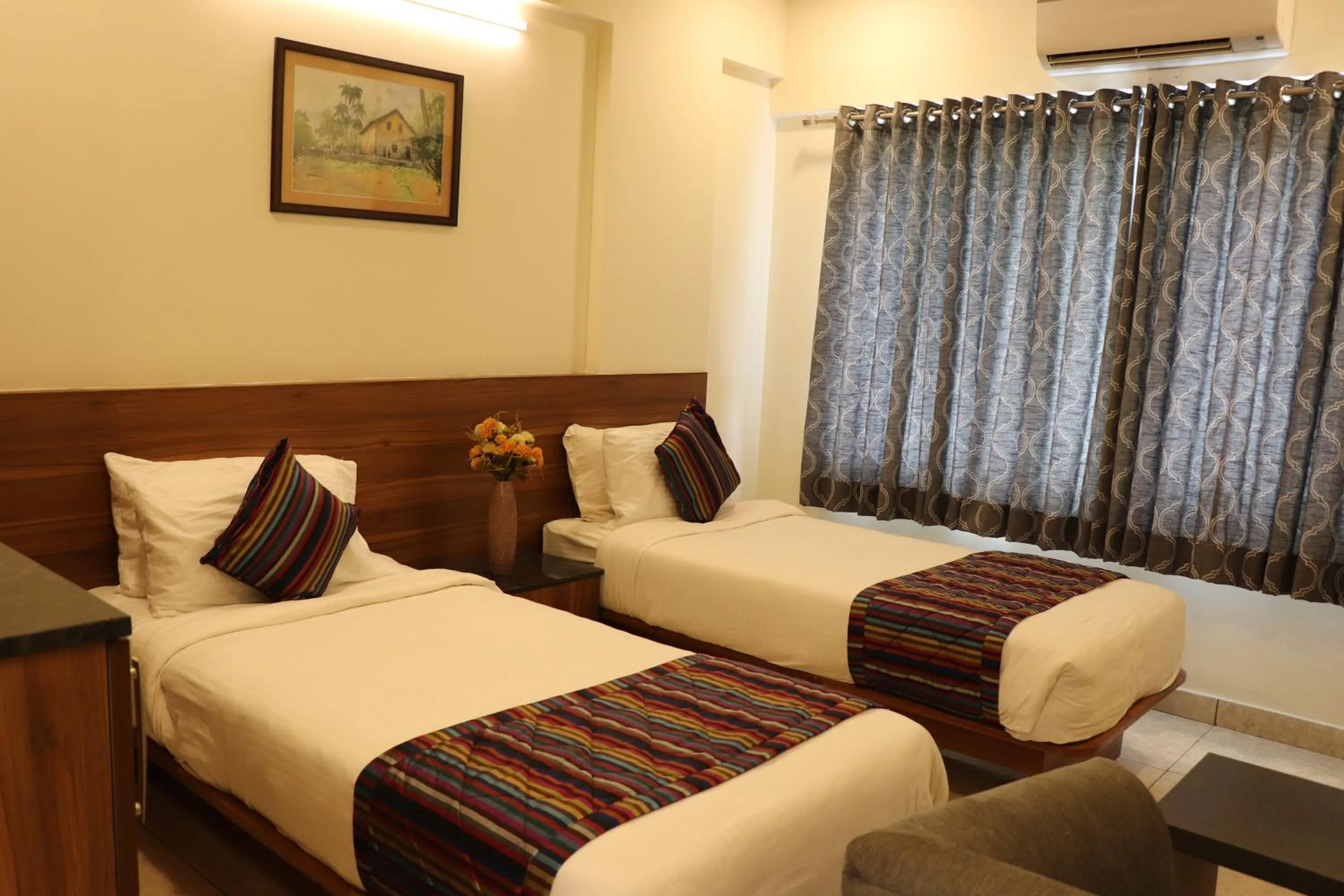 Bed in Silicon Inn Hotel Bangalore Airport