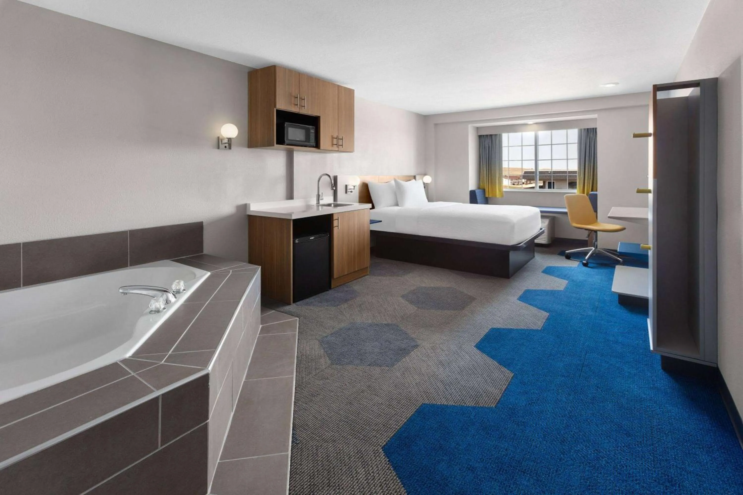 Photo of the whole room, Bed in Microtel Inn & Suites by Wyndham Rapid City