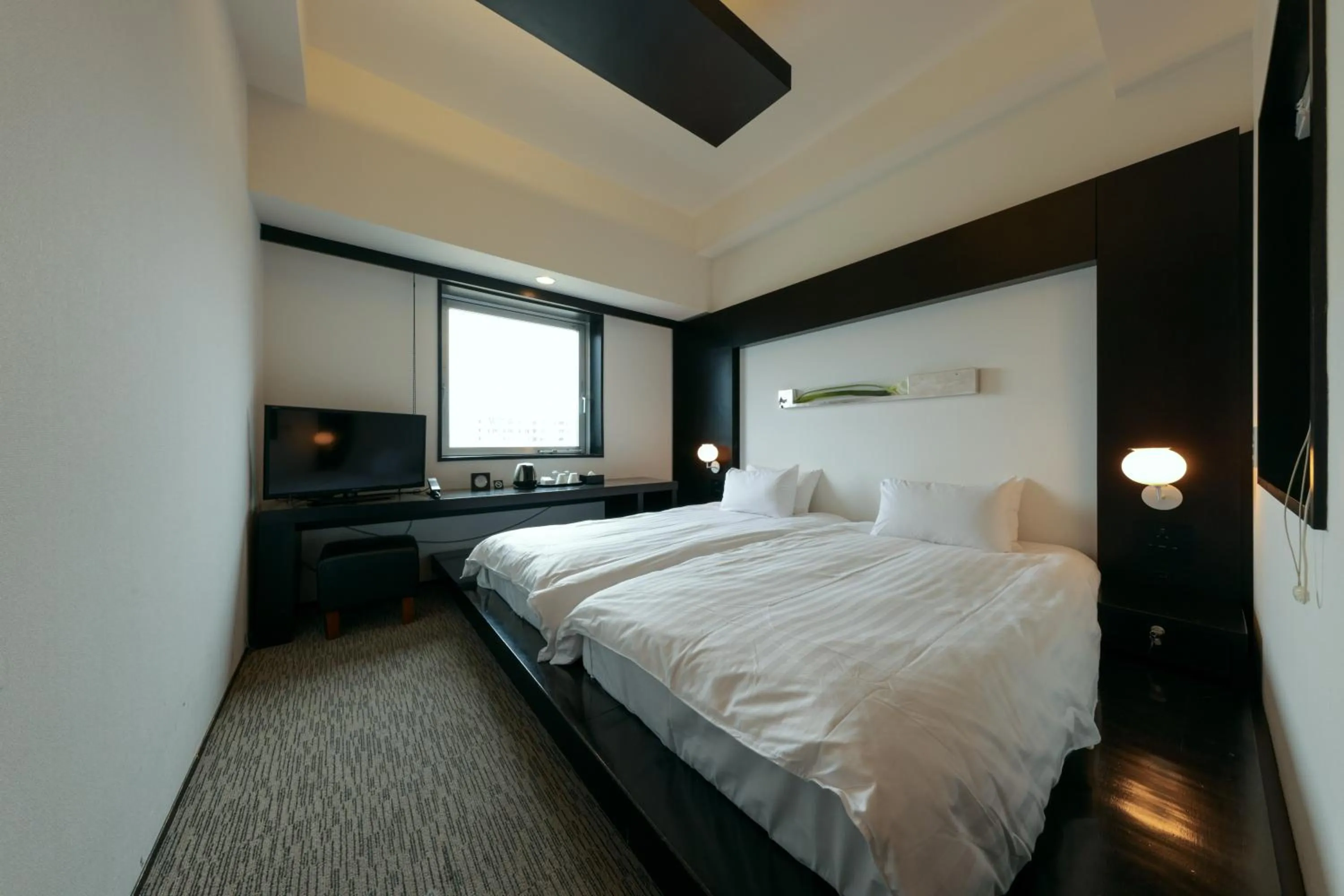 Bed in Furano Natulux Hotel