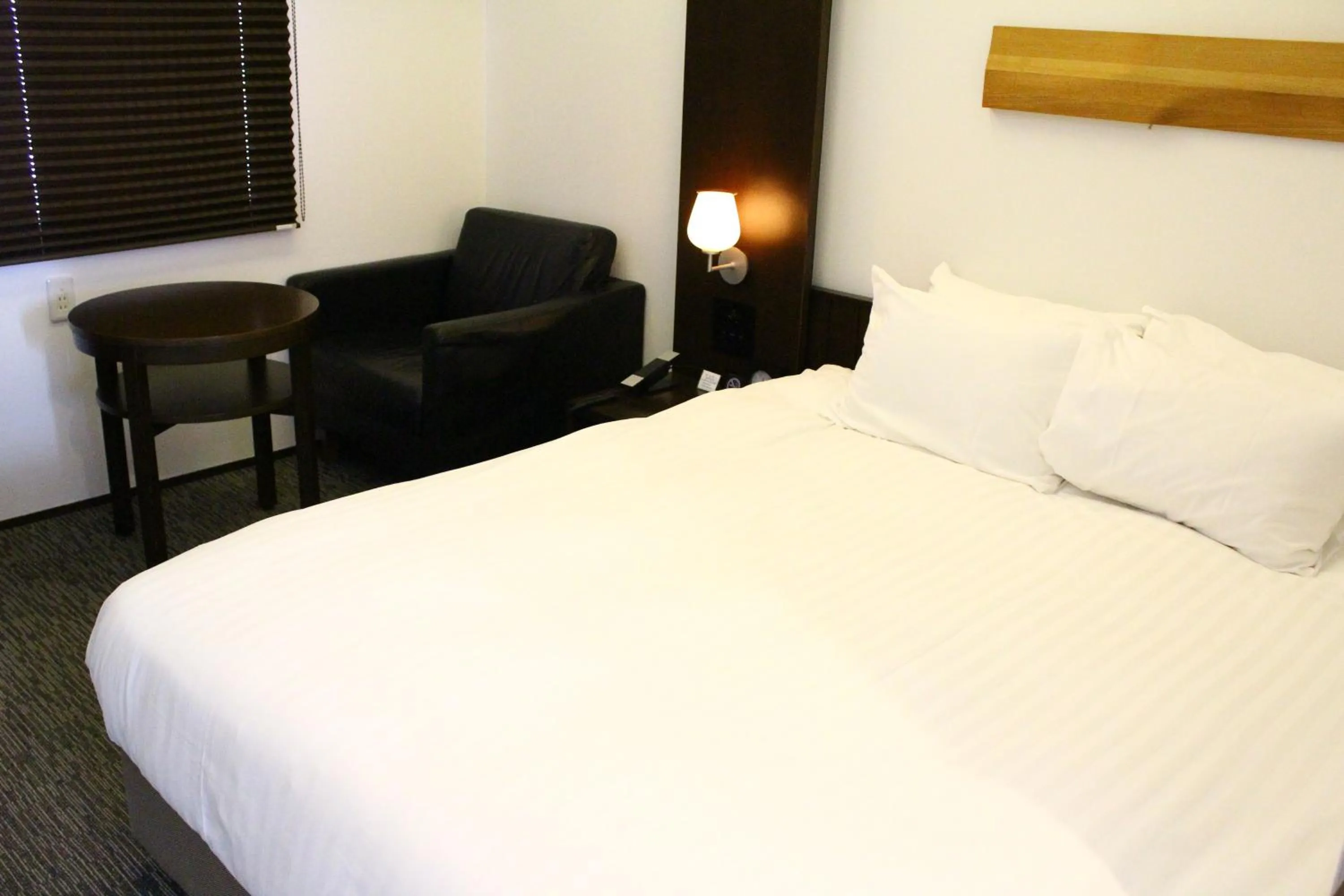 Bed in Furano Natulux Hotel