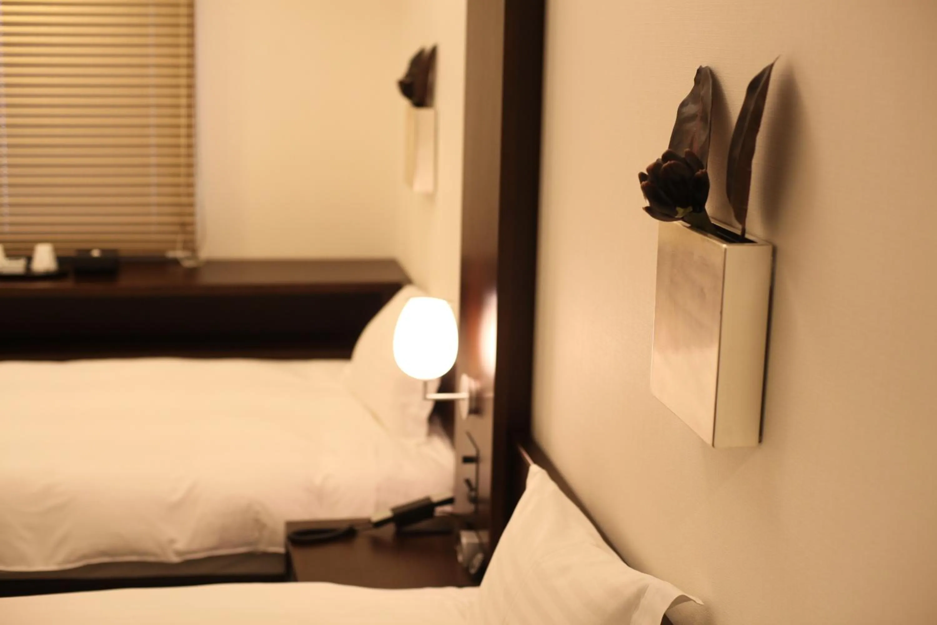 Bed in Furano Natulux Hotel