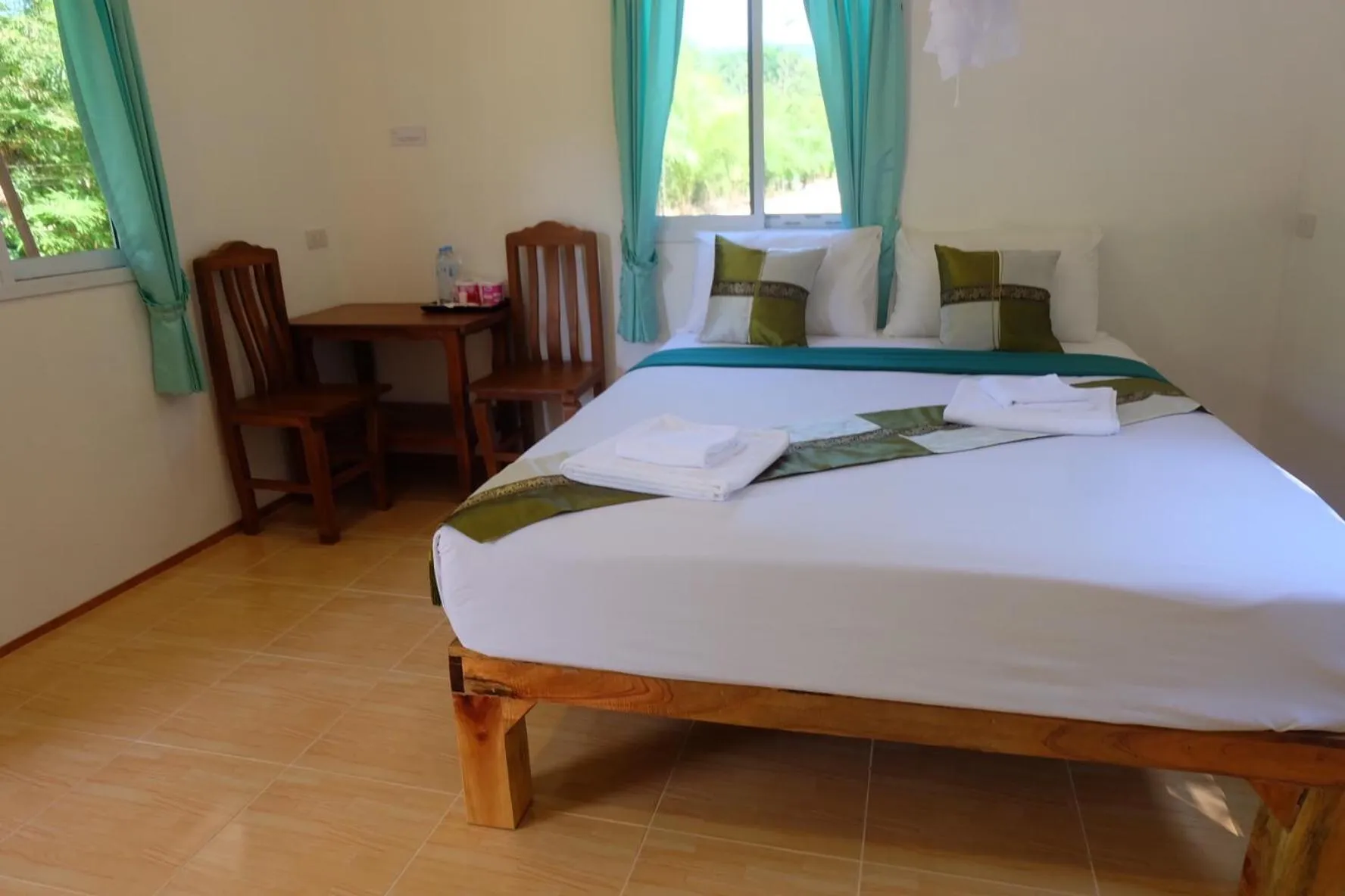 Bed in Khaosok Bamboo Huts Resort