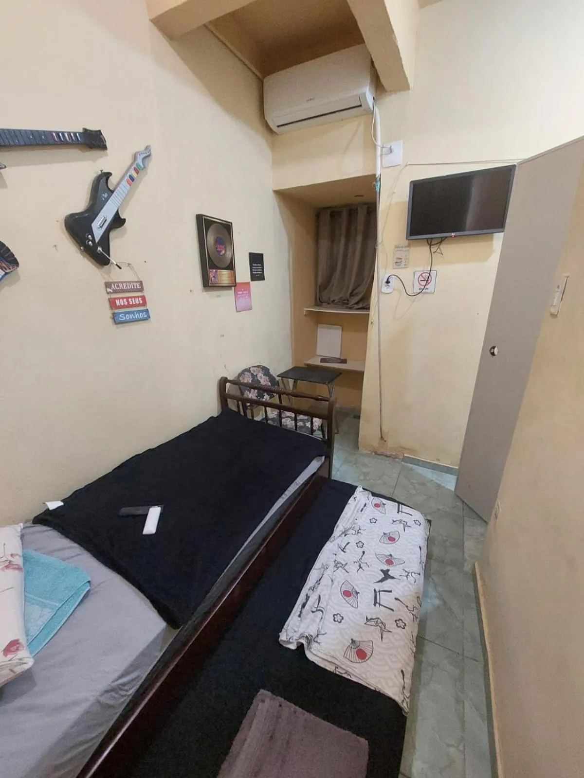 Bed in Pousada Cantinho da Família