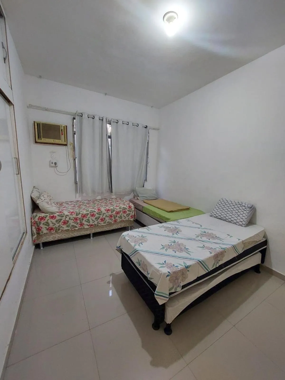 Bed in Pousada Cantinho da Família