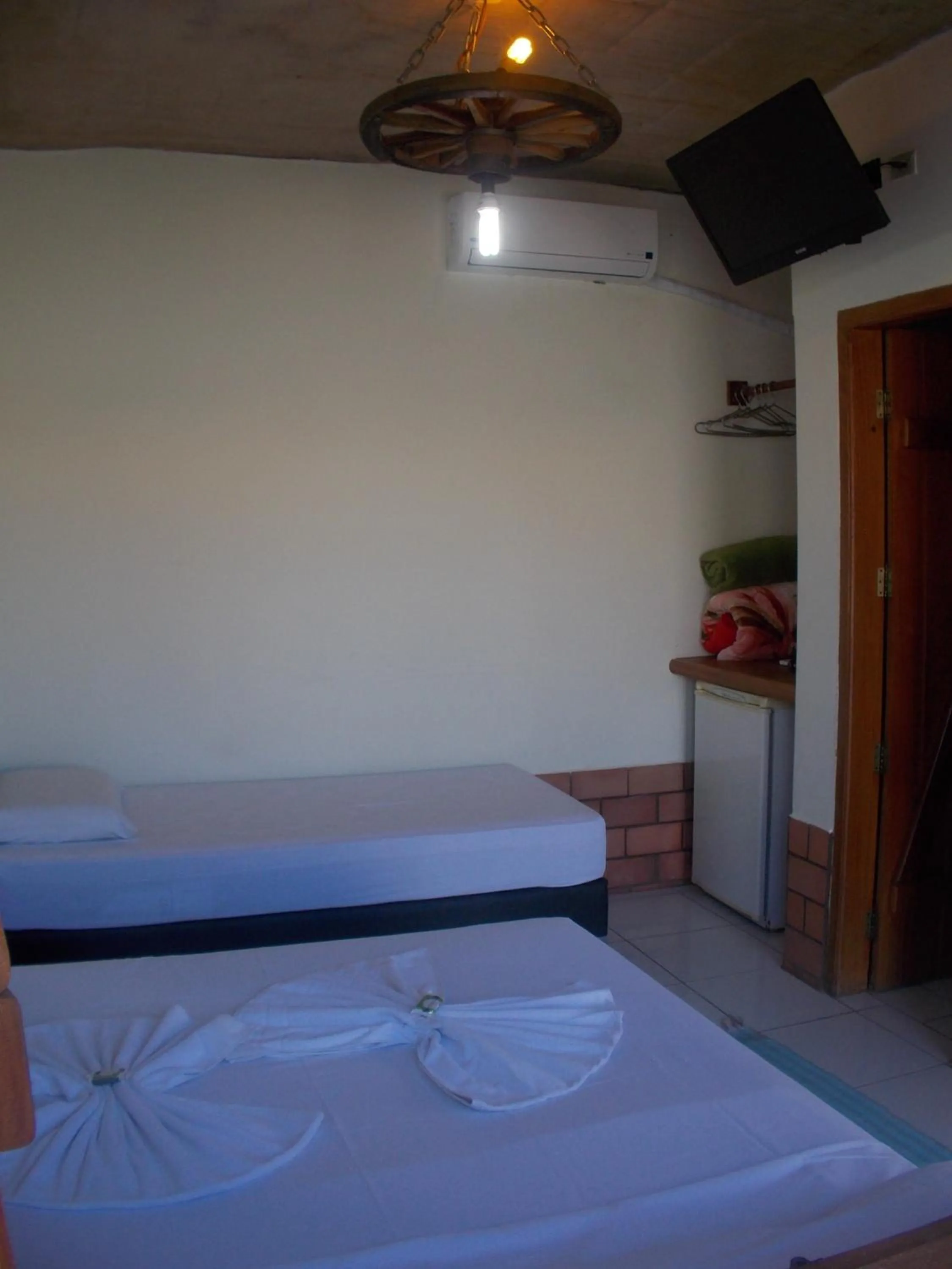 Bed in Pousada Segredo