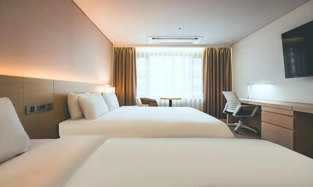 Bed in Wonju City Hotel HYEOKSIN