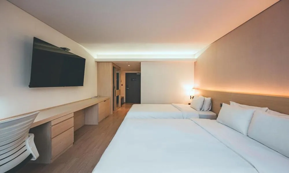 Bed in Wonju City Hotel HYEOKSIN