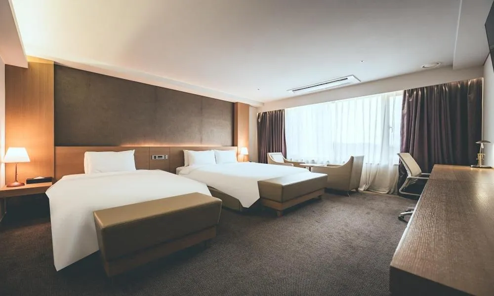 Bed in Wonju City Hotel HYEOKSIN