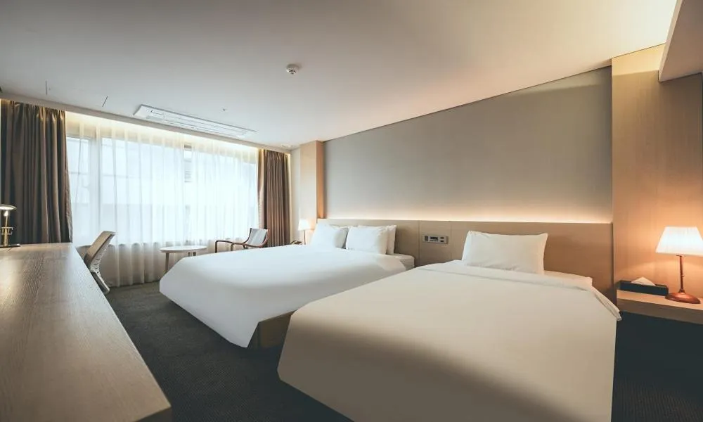 Bed in Wonju City Hotel HYEOKSIN