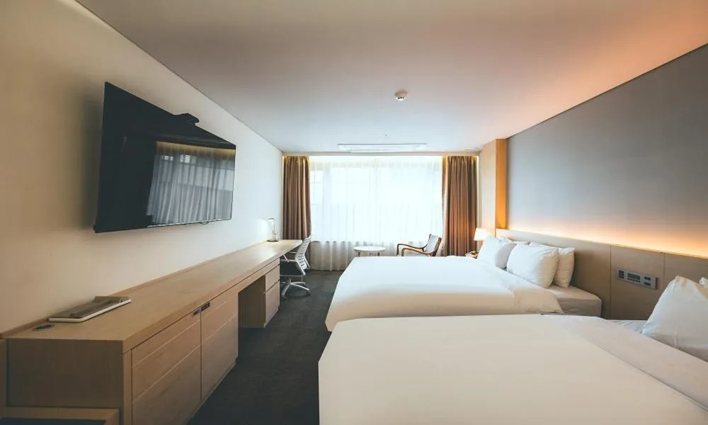 Bed in Wonju City Hotel HYEOKSIN