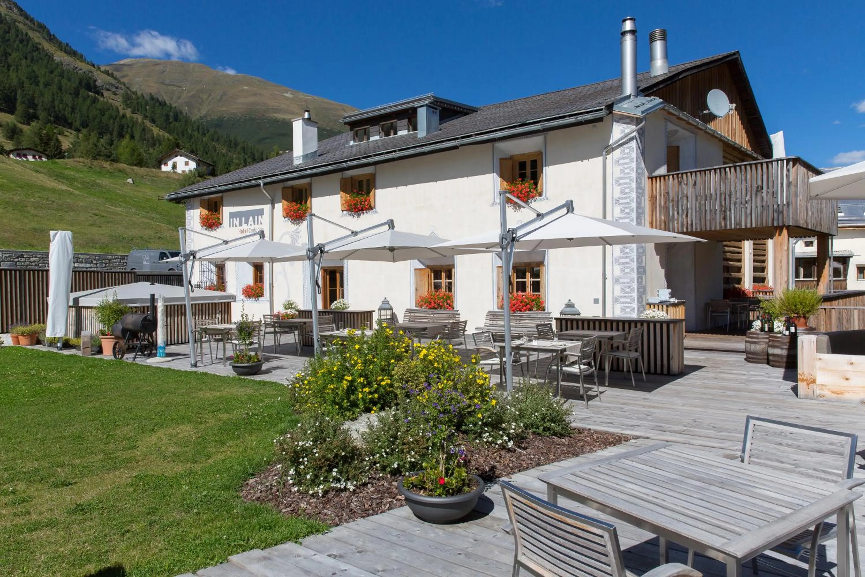 Property building in Relais & Châteaux IN LAIN Hotel Cadonau
