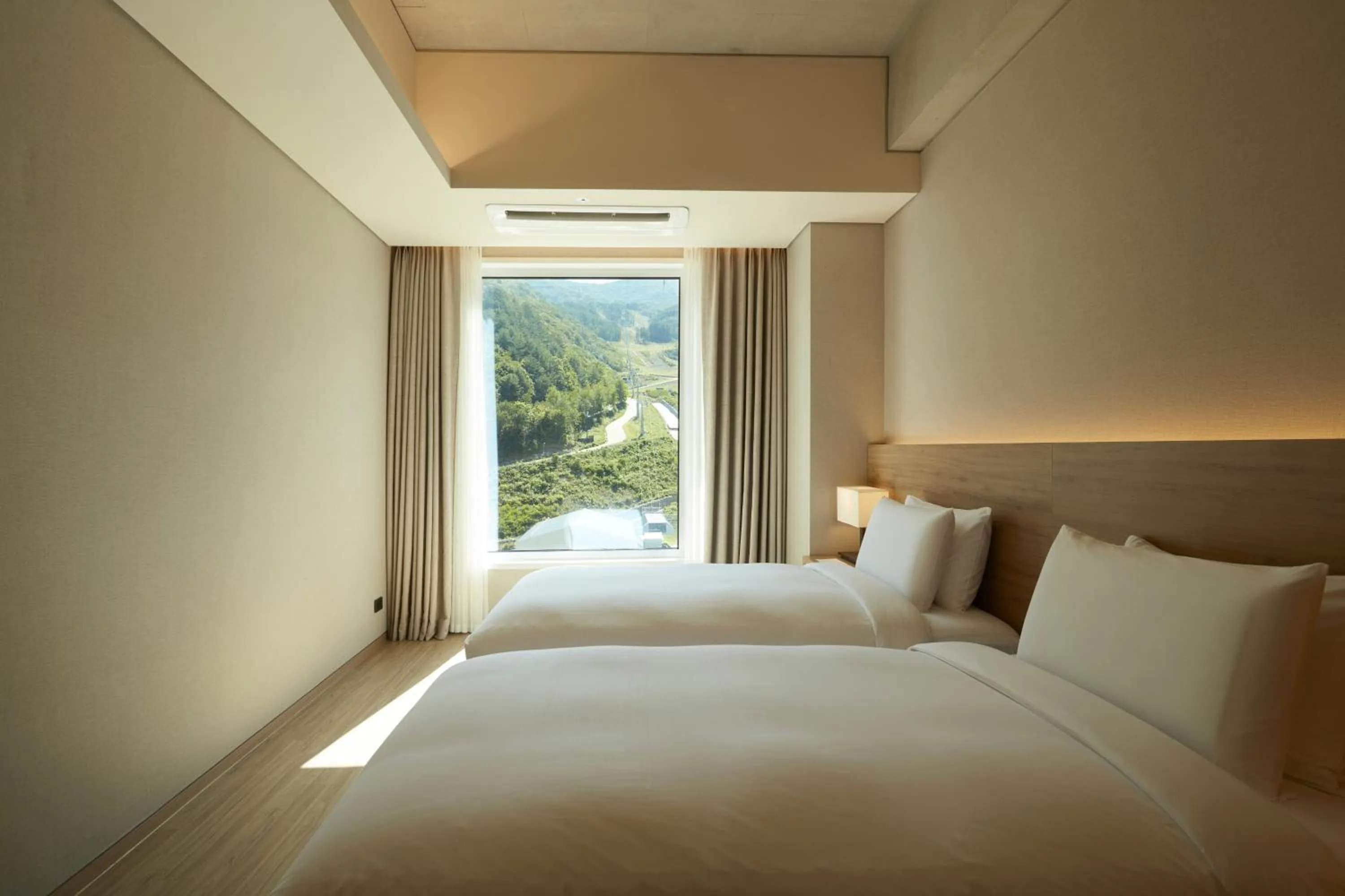 Bed in PARK ROCHE Resort & Wellness