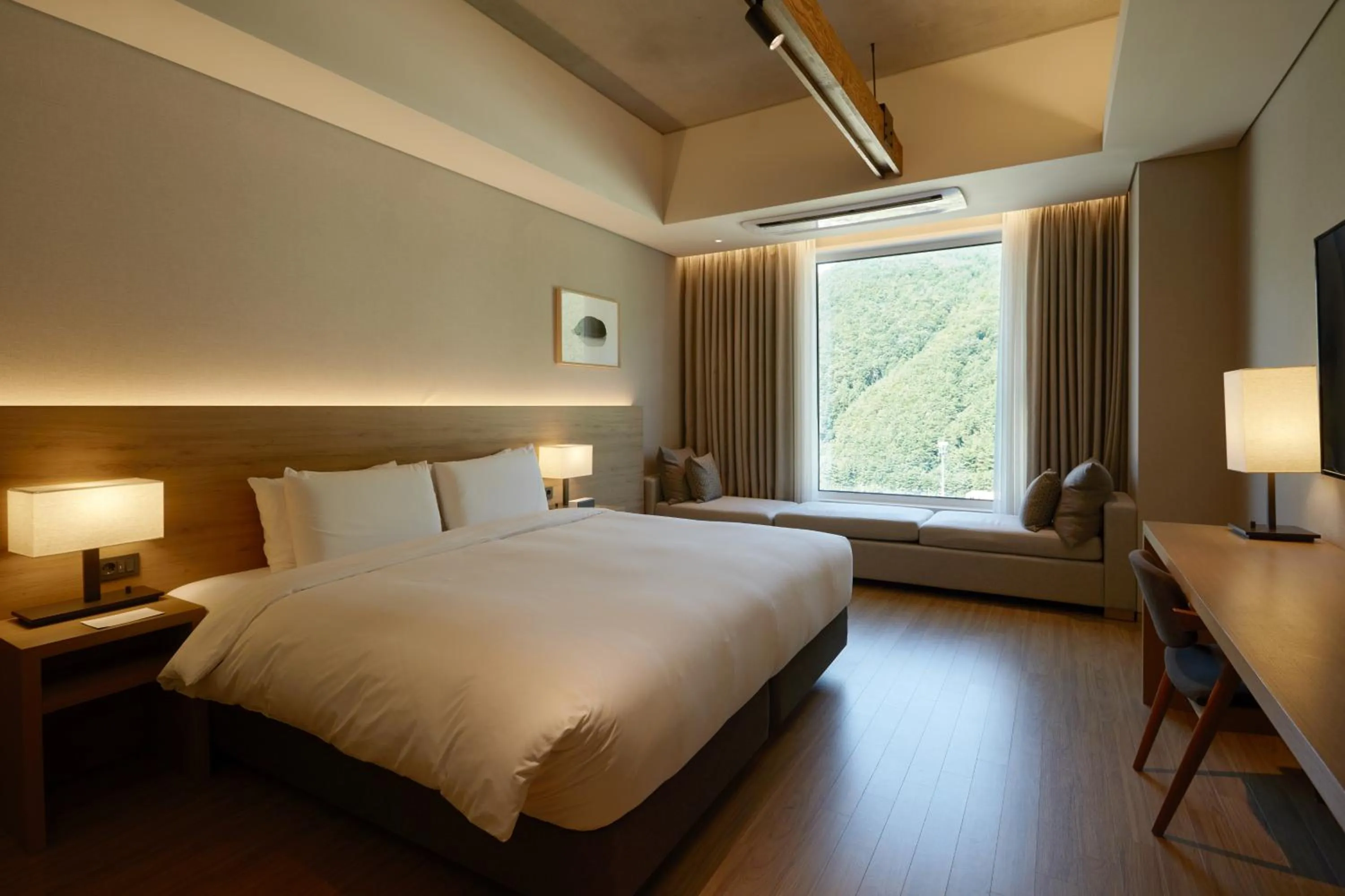 Bed in PARK ROCHE Resort & Wellness