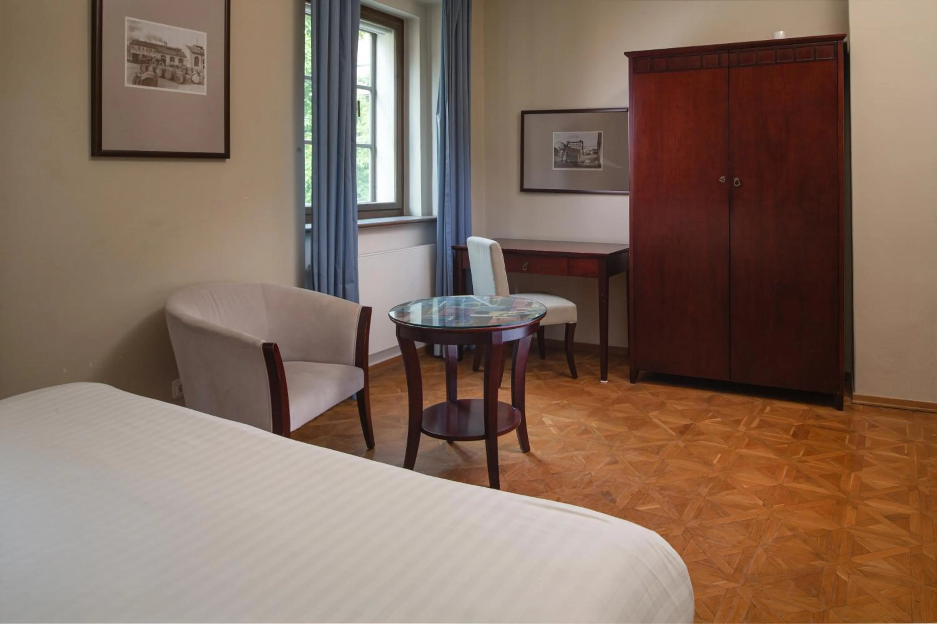 Seating area, Bed in Charles Bridge Rooms & Suites by SIVEK HOTELS