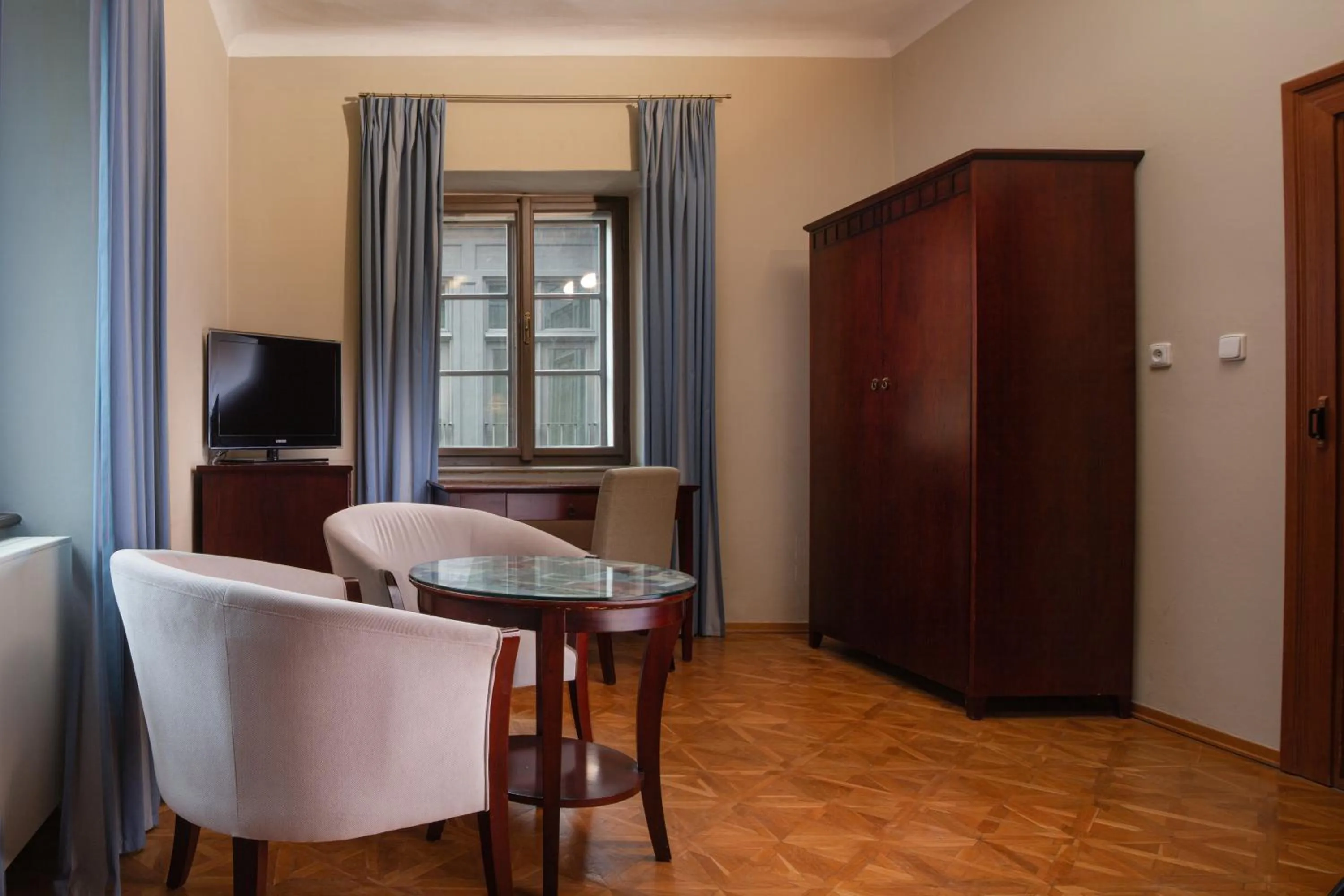 Seating area in Charles Bridge Rooms & Suites by SIVEK HOTELS