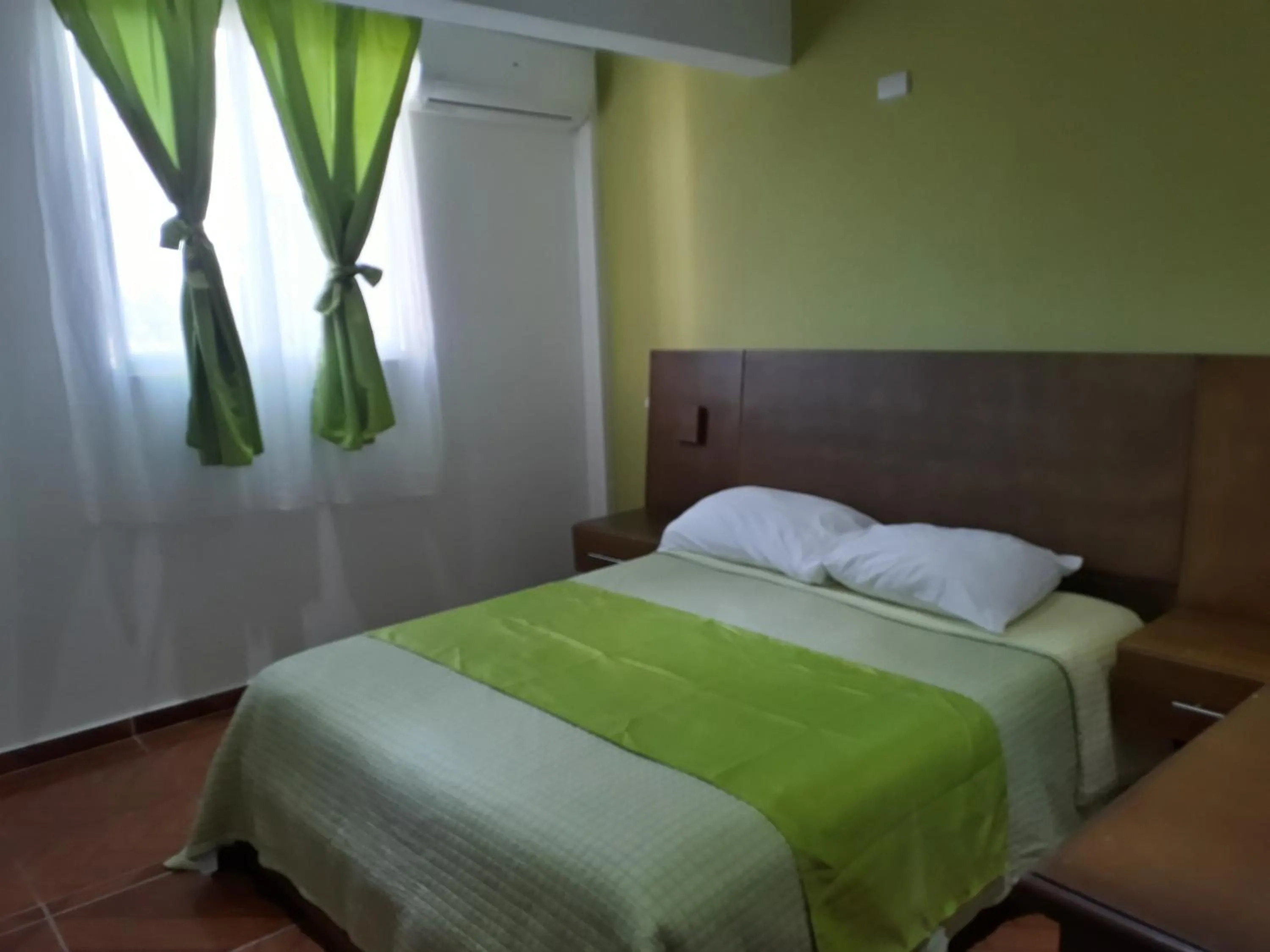 Bed in Figaro Hotel Samana