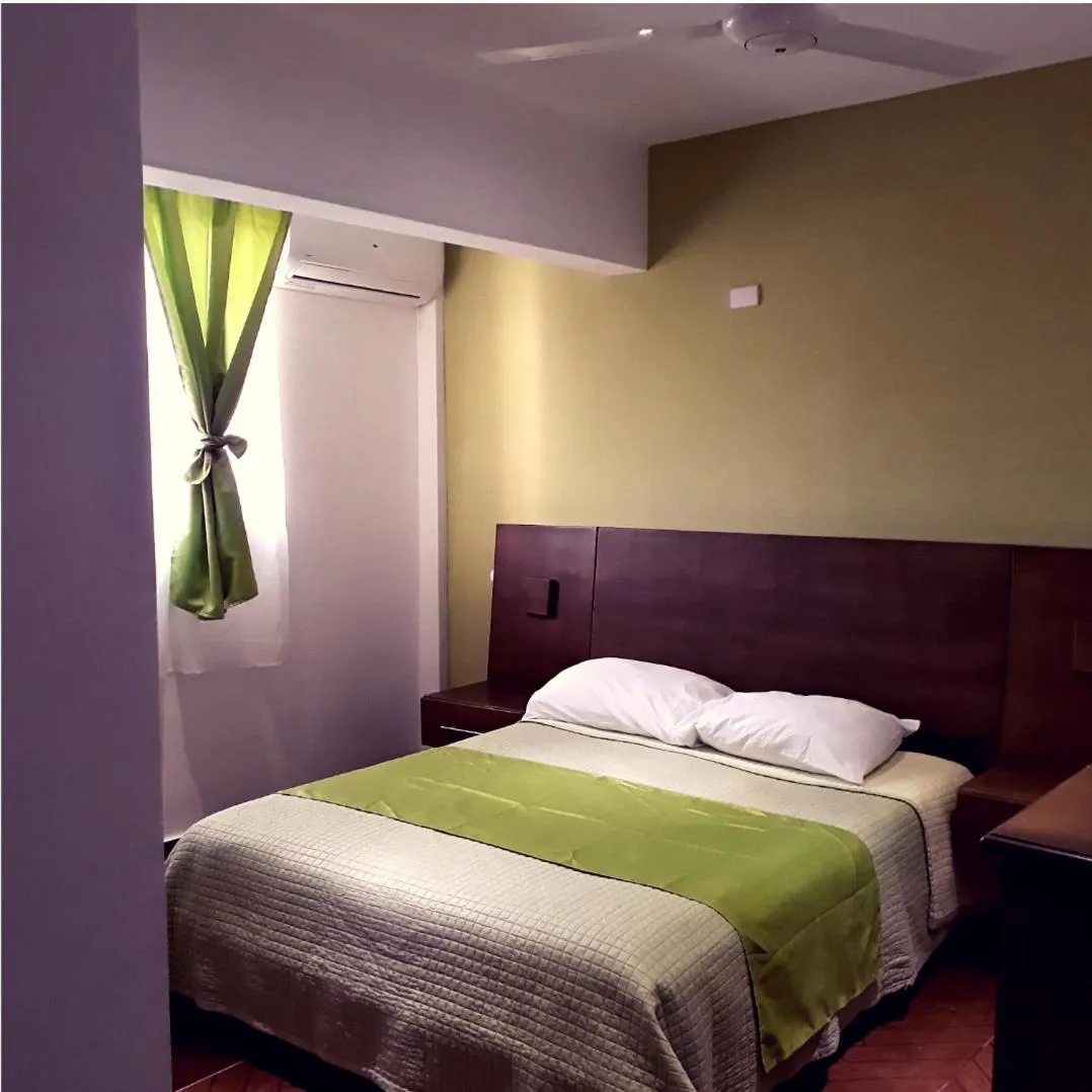 Bed in Figaro Hotel Samana