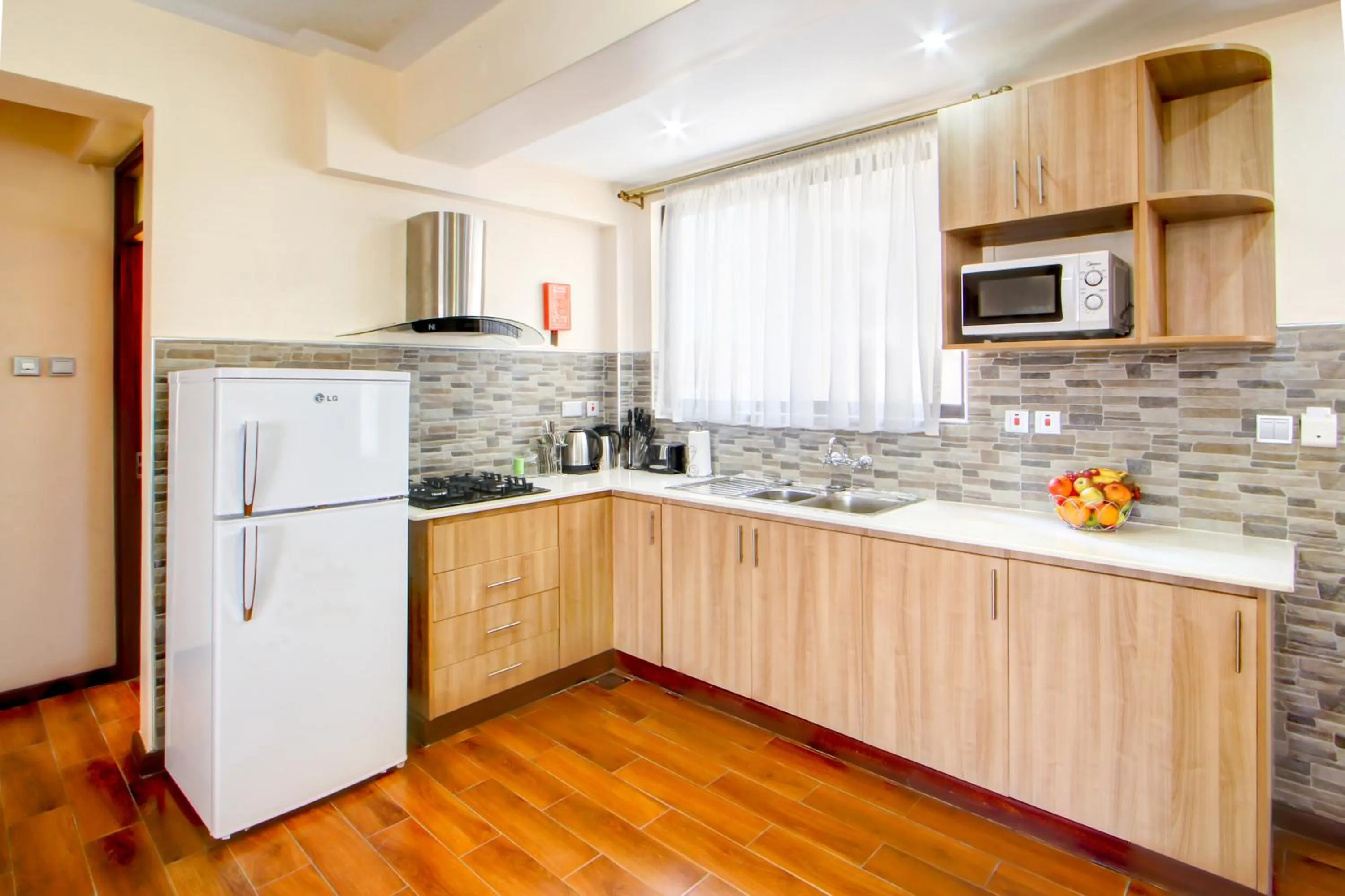 Kitchen or kitchenette in Highlands Suites Hotel Apartments